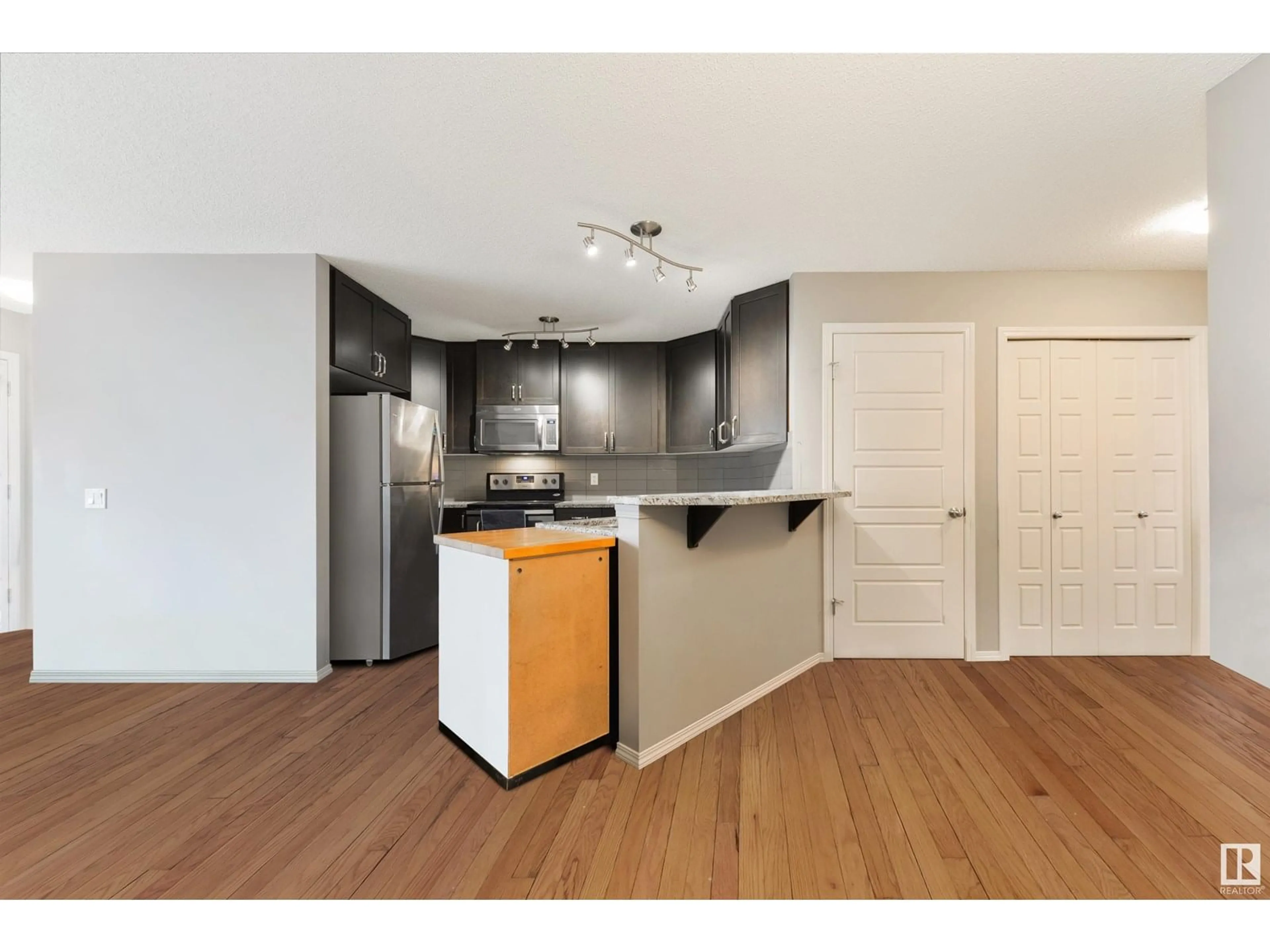 Open concept kitchen, wood/laminate floor for 7161 CARDINAL WY, Edmonton Alberta T6W2Y3