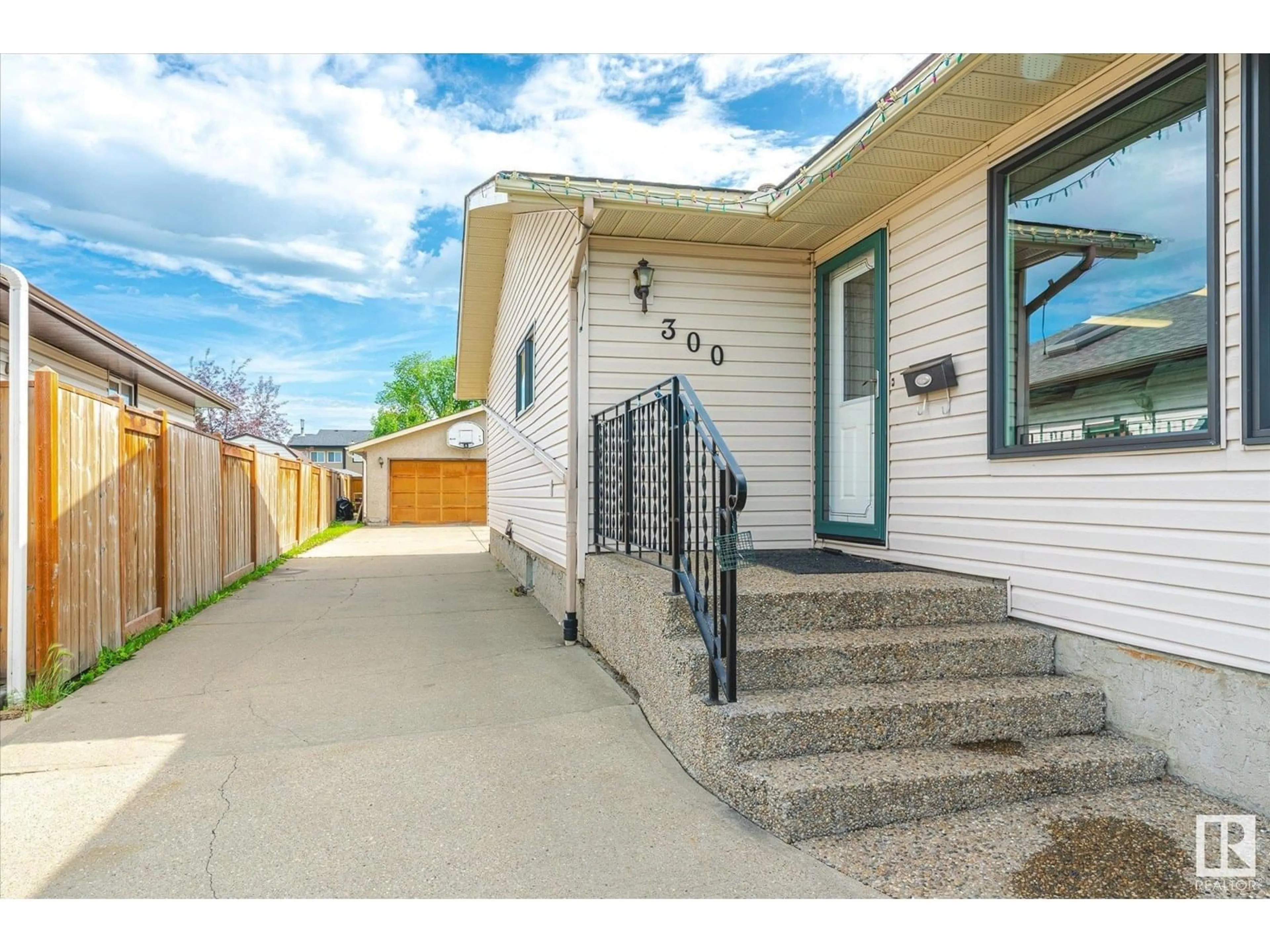 Home with vinyl exterior material, street for 300 DUNLUCE RD, Edmonton Alberta T5X4P3