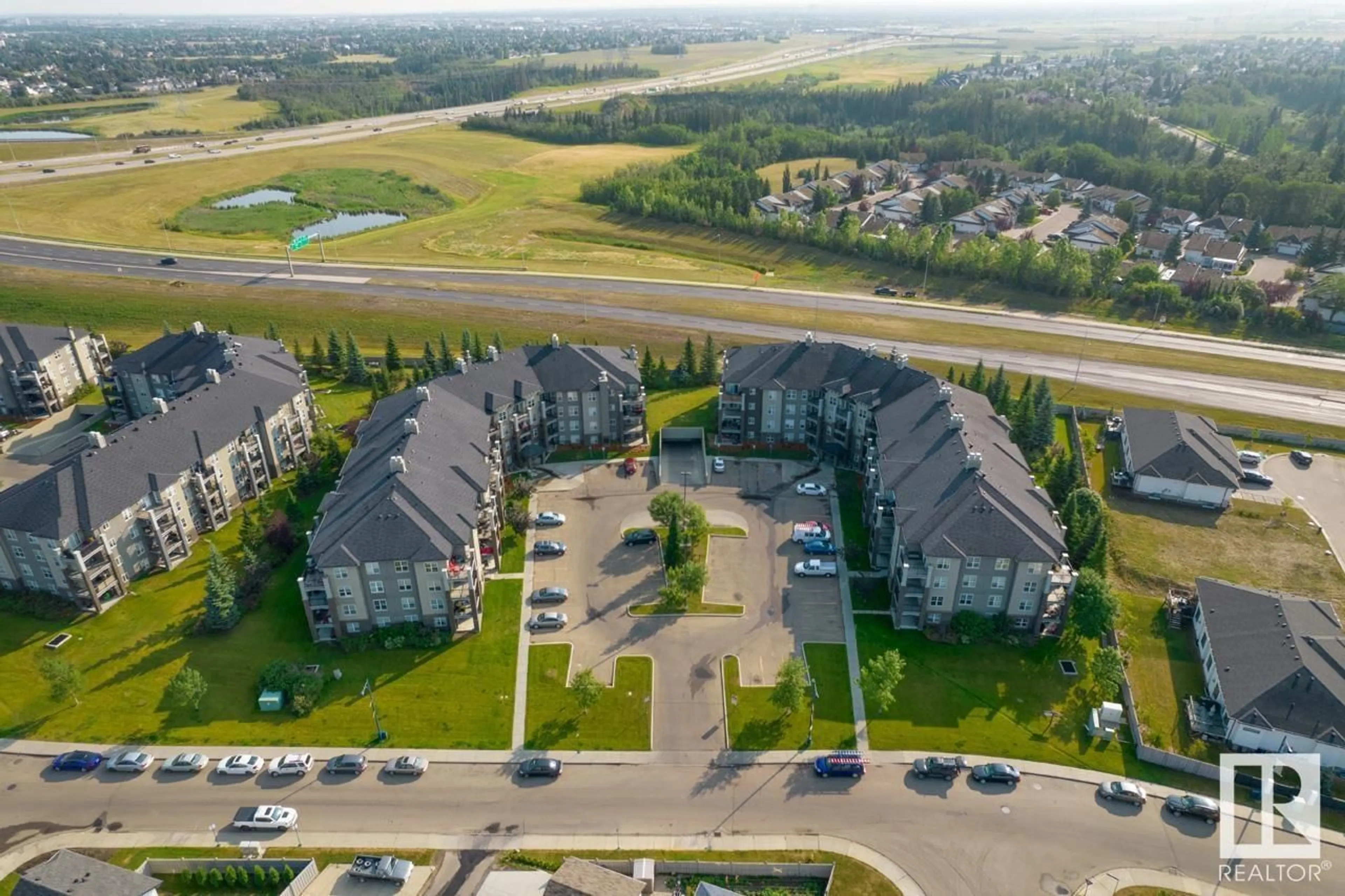 A pic from outside/outdoor area/front of a property/back of a property/a pic from drone, unknown for #412 - 630 MCALLISTER LO, Edmonton Alberta T6W1N3