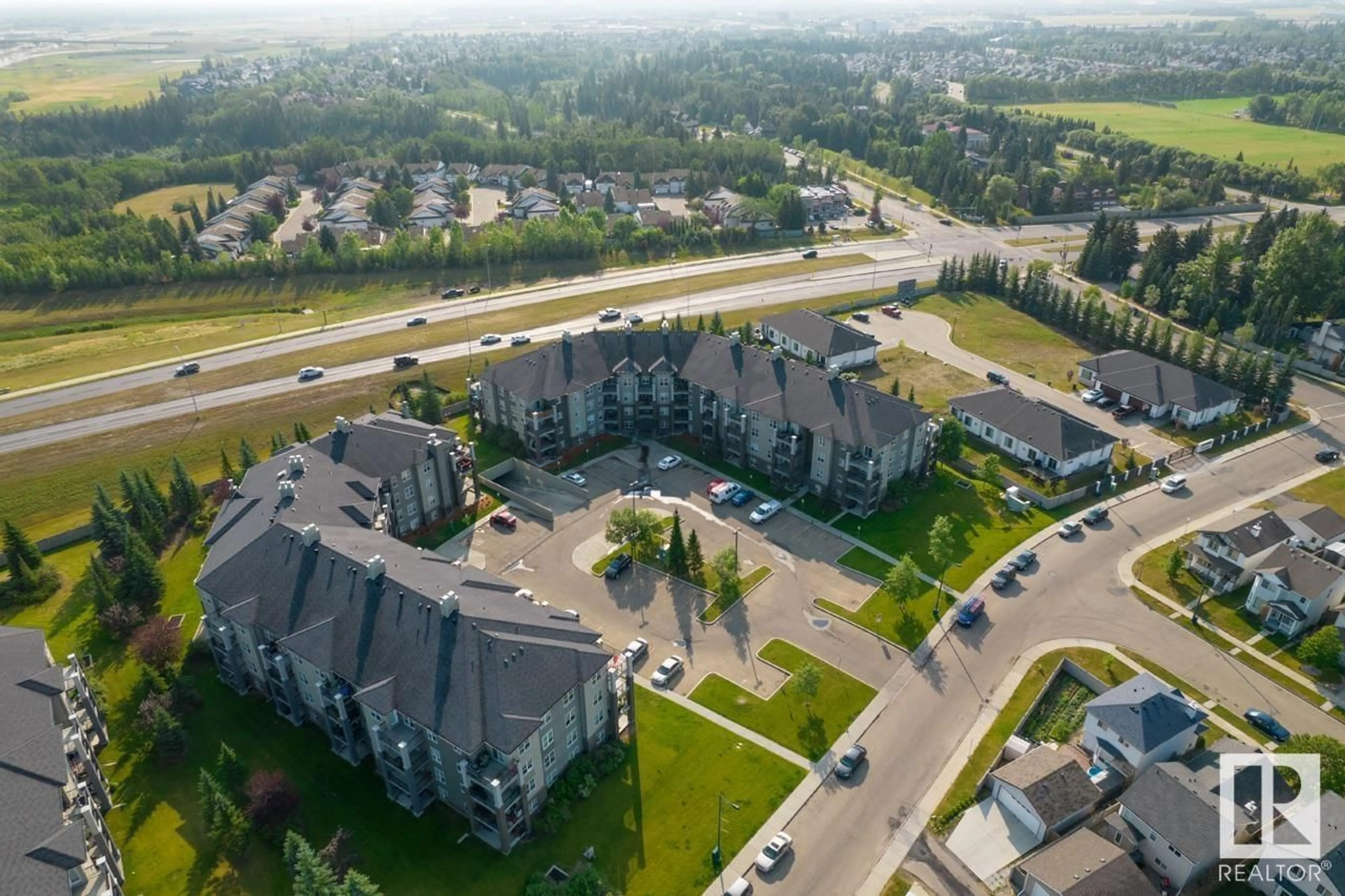 A pic from outside/outdoor area/front of a property/back of a property/a pic from drone, unknown for #412 - 630 MCALLISTER LO, Edmonton Alberta T6W1N3
