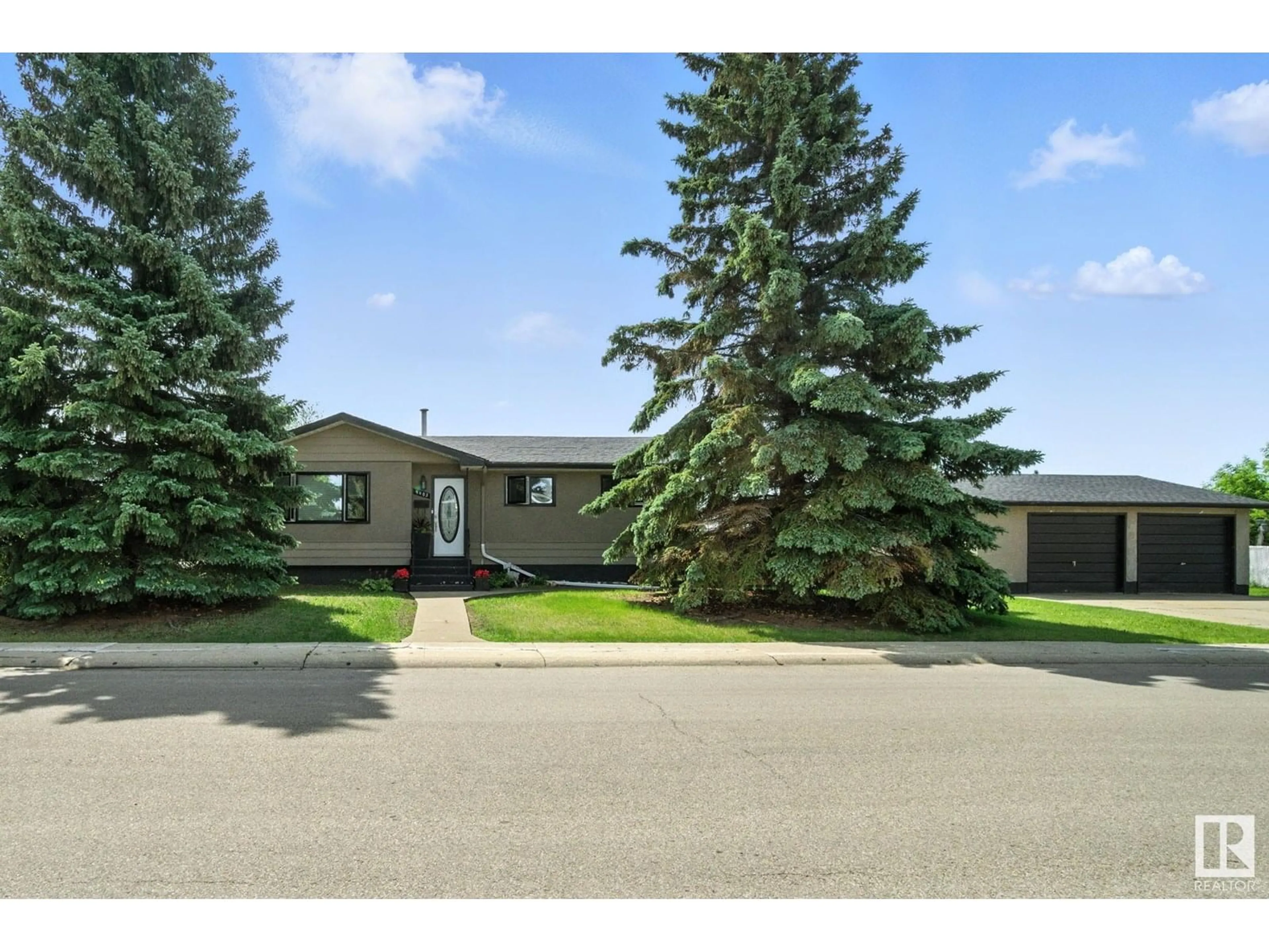 A pic from outside/outdoor area/front of a property/back of a property/a pic from drone, street for 9403 149 AV, Edmonton Alberta T5E5W4