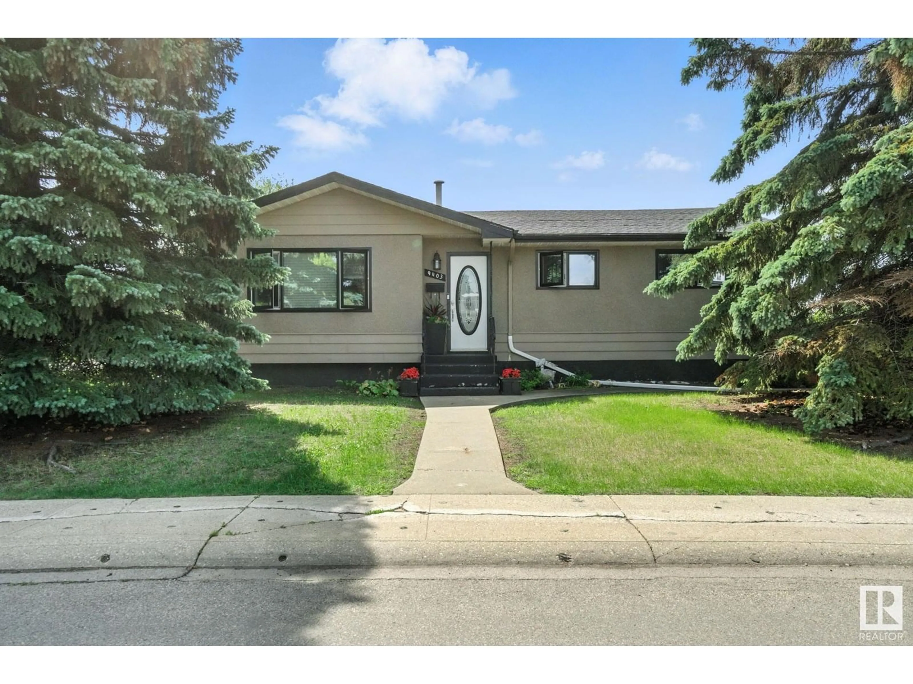 Home with vinyl exterior material, street for 9403 149 AV, Edmonton Alberta T5E5W4