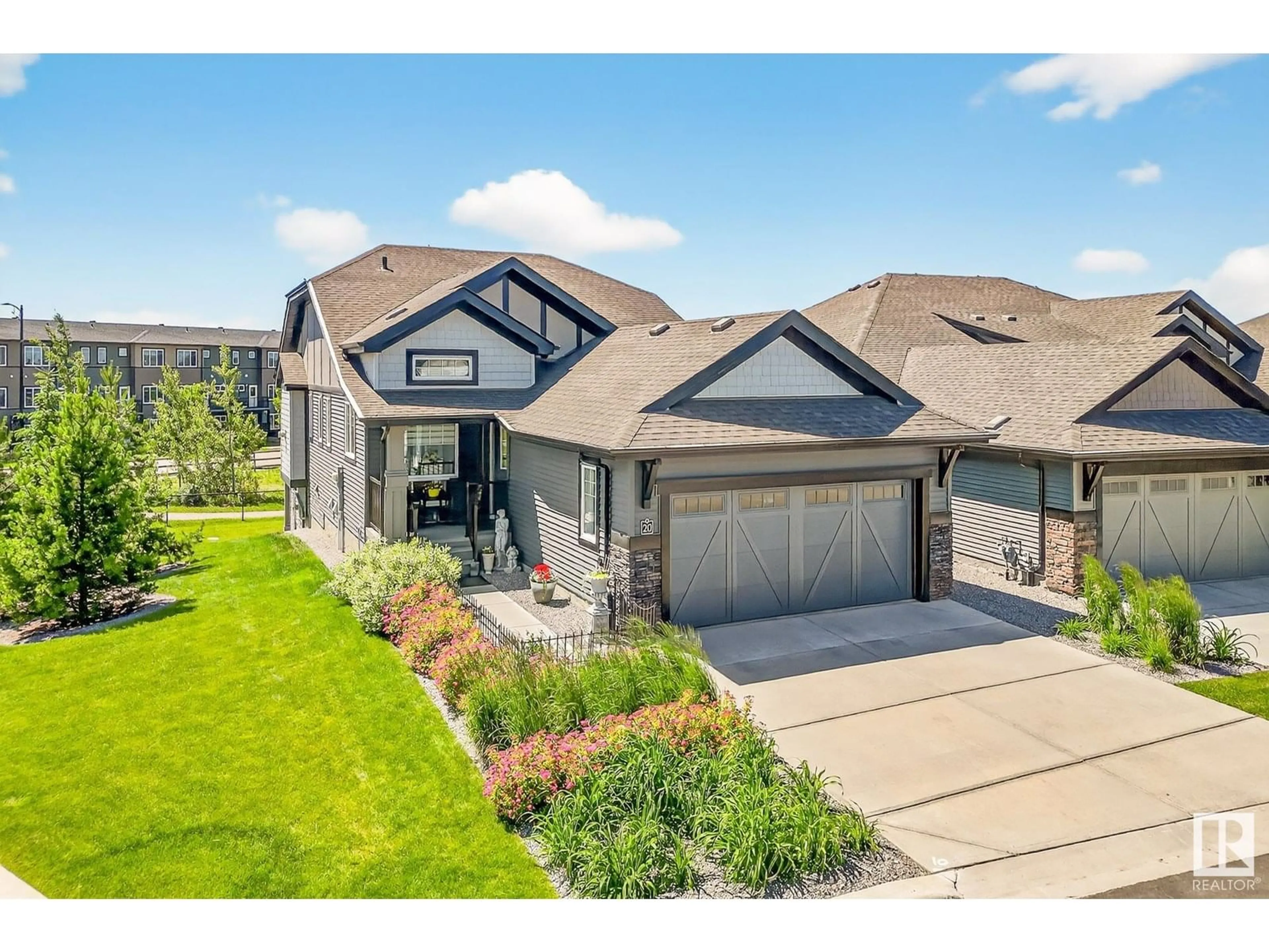 Home with brick exterior material, street for 8050 - 20 ORCHARDS GREEN GR, Edmonton Alberta T6X2N2