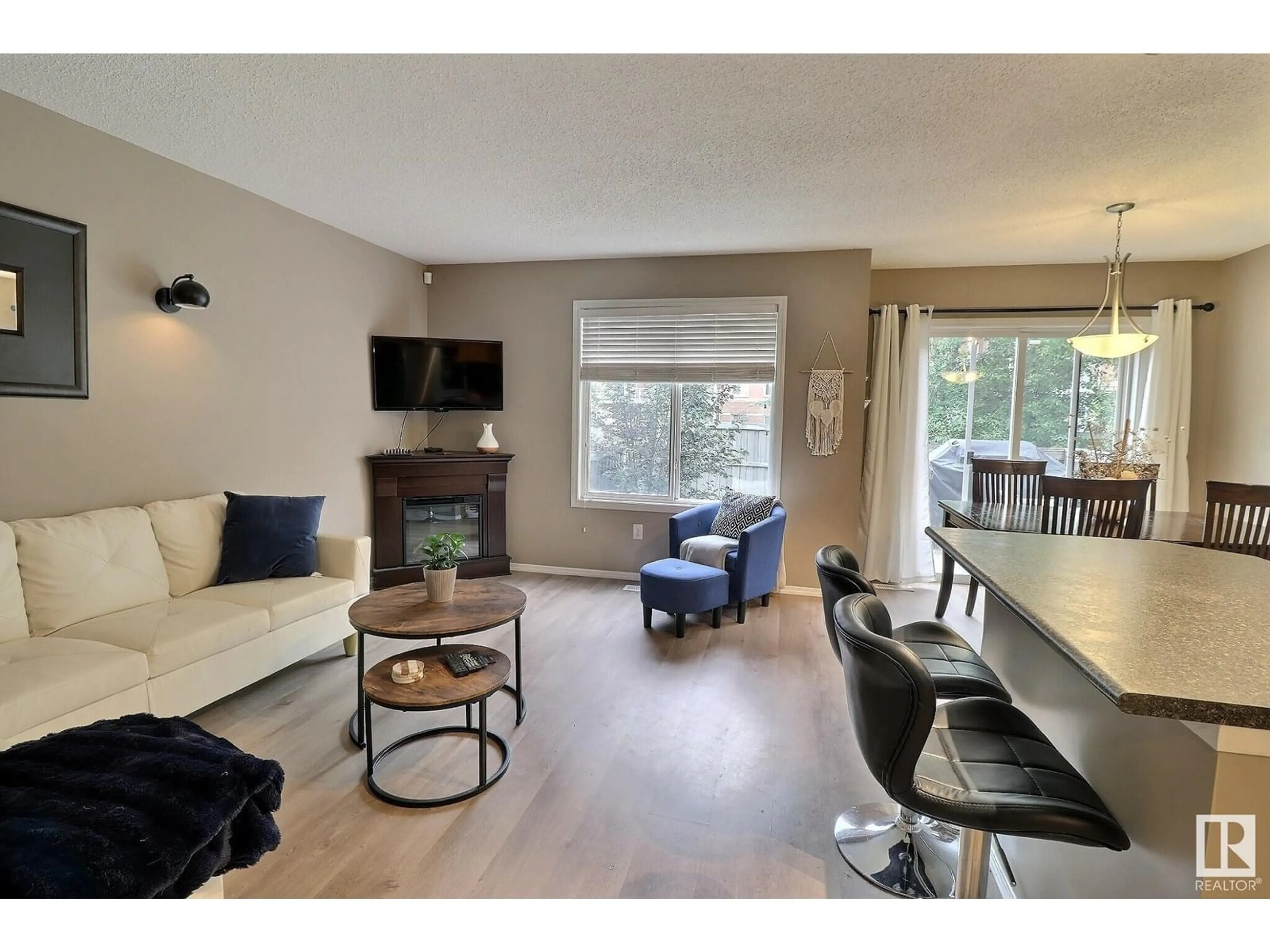 Living room with furniture, wood/laminate floor for 36 - 287 MACEWAN RD, Edmonton Alberta T6W1T4