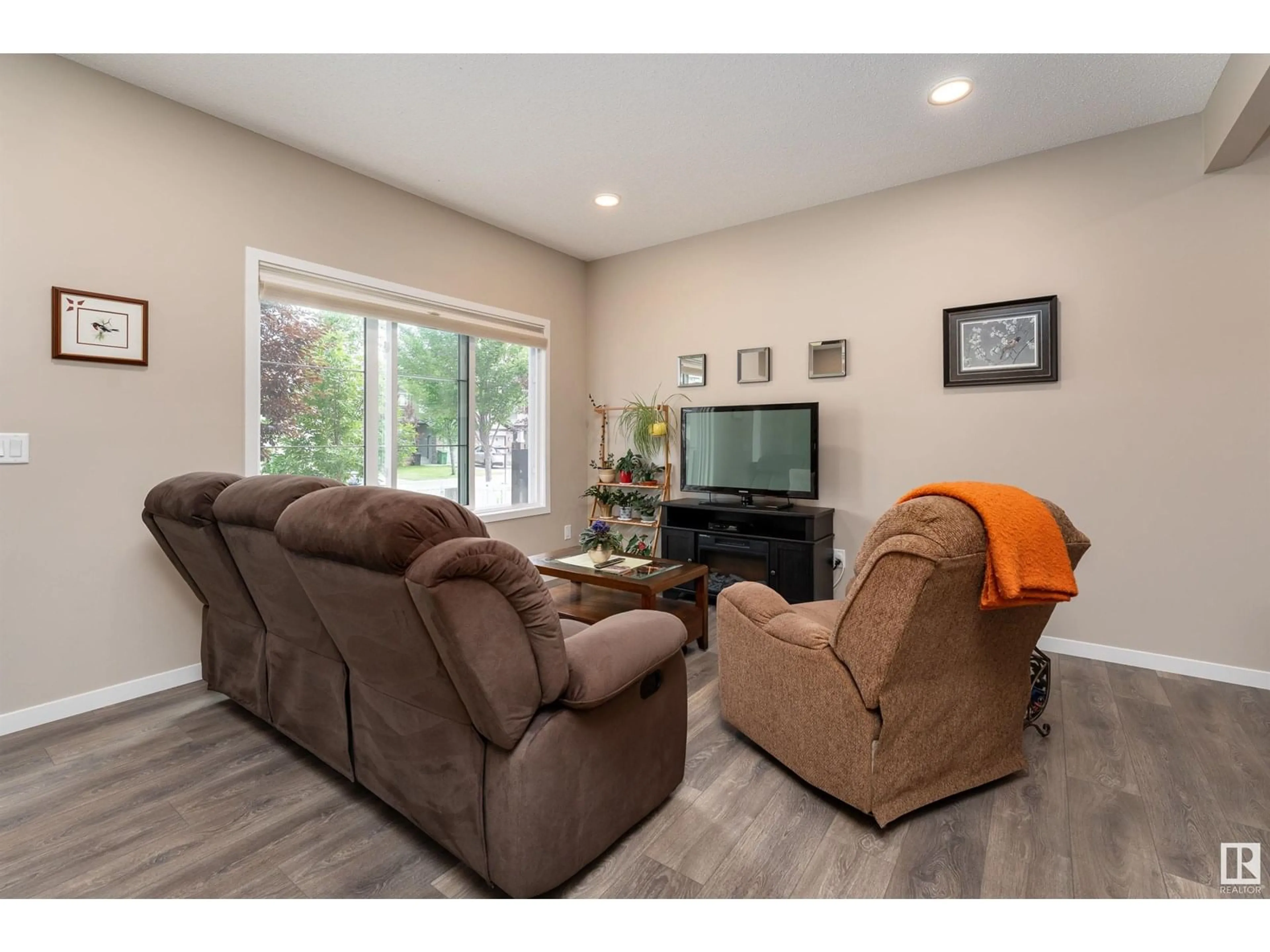 Living room with furniture, wood/laminate floor for 180 SANTANA CR, Fort Saskatchewan Alberta T8L0T4