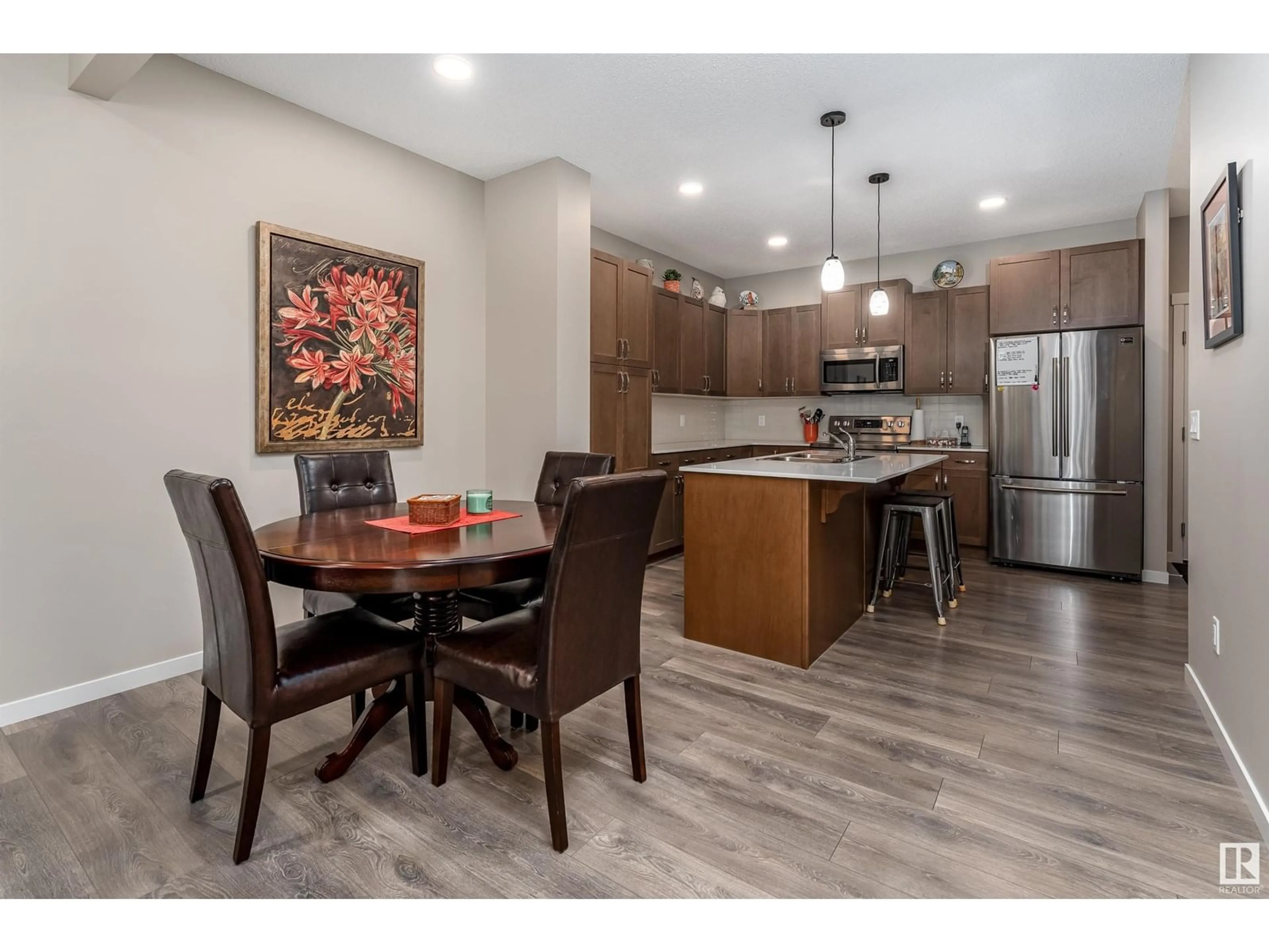 Open concept kitchen, wood/laminate floor for 180 SANTANA CR, Fort Saskatchewan Alberta T8L0T4