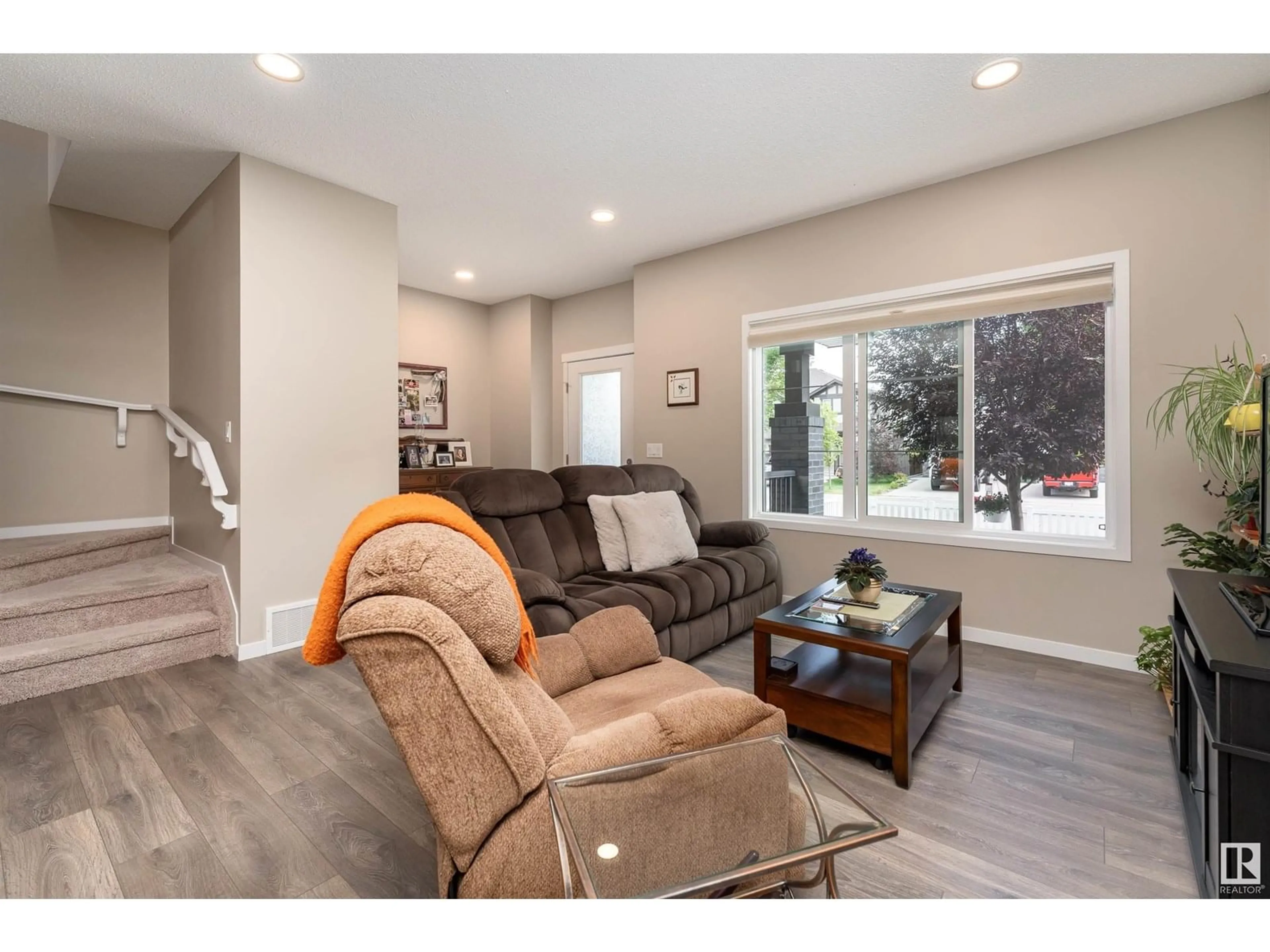 Living room with furniture, wood/laminate floor for 180 SANTANA CR, Fort Saskatchewan Alberta T8L0T4