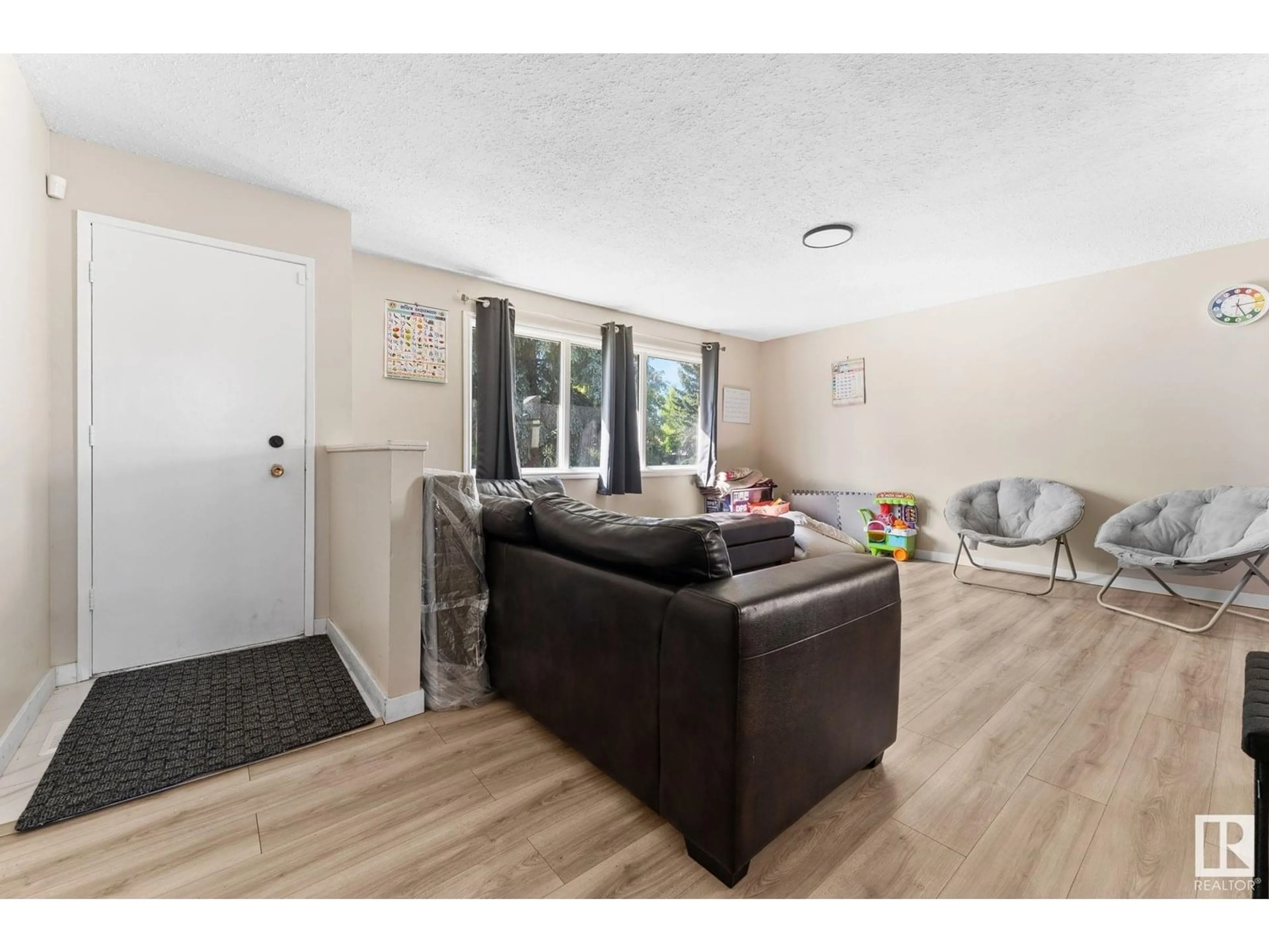 Living room with furniture, wood/laminate floor for 363 KNOTTWOOD RD, Edmonton Alberta T6K2G4