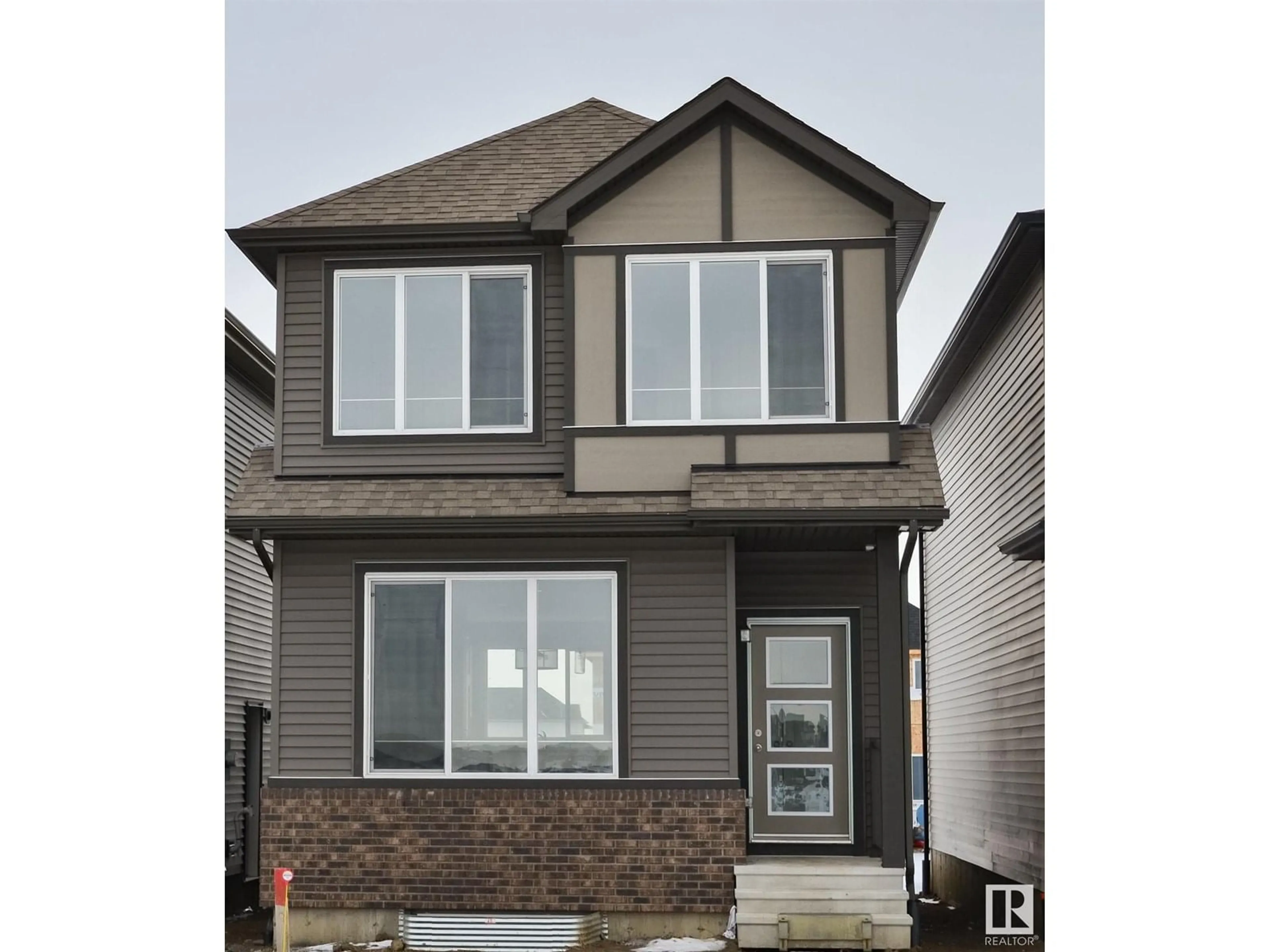 Home with vinyl exterior material, street for NW - 18839 29 AV, Edmonton Alberta T6M3C4