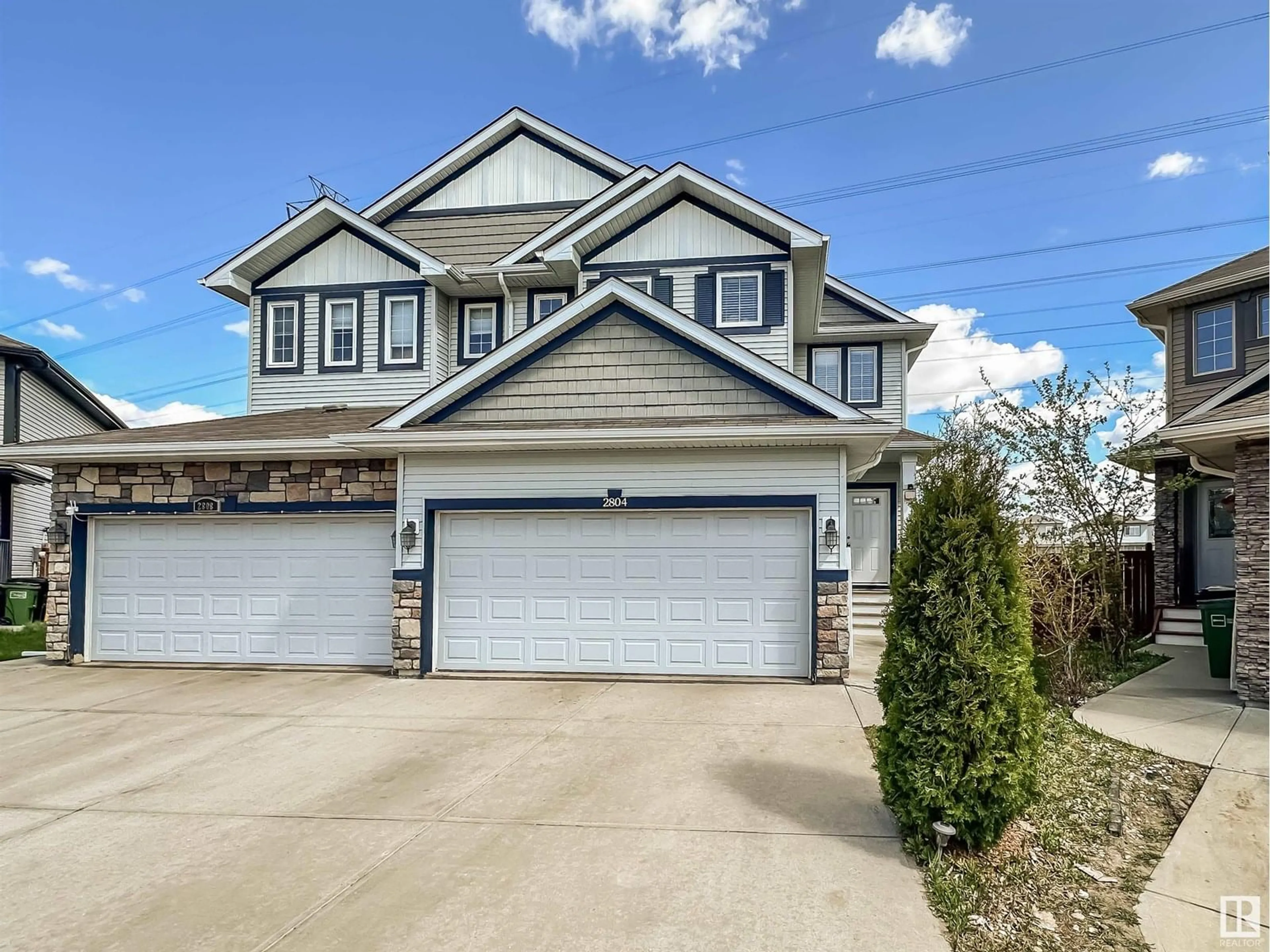 Home with vinyl exterior material, street for 2804 16 AV, Edmonton Alberta T6T0Z6