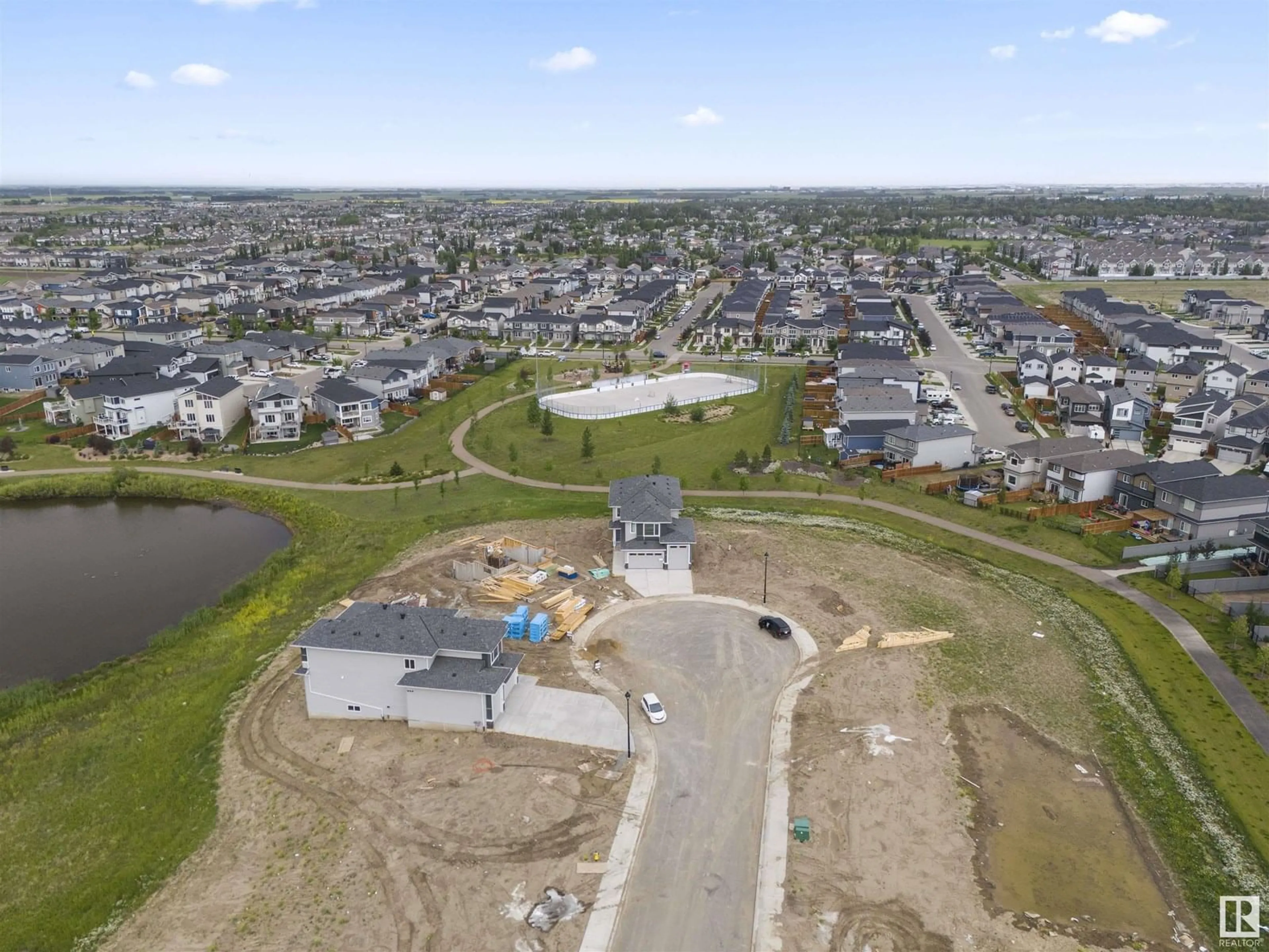 A pic from outside/outdoor area/front of a property/back of a property/a pic from drone, street for 216 BASIN CO, Leduc Alberta T2R0A2