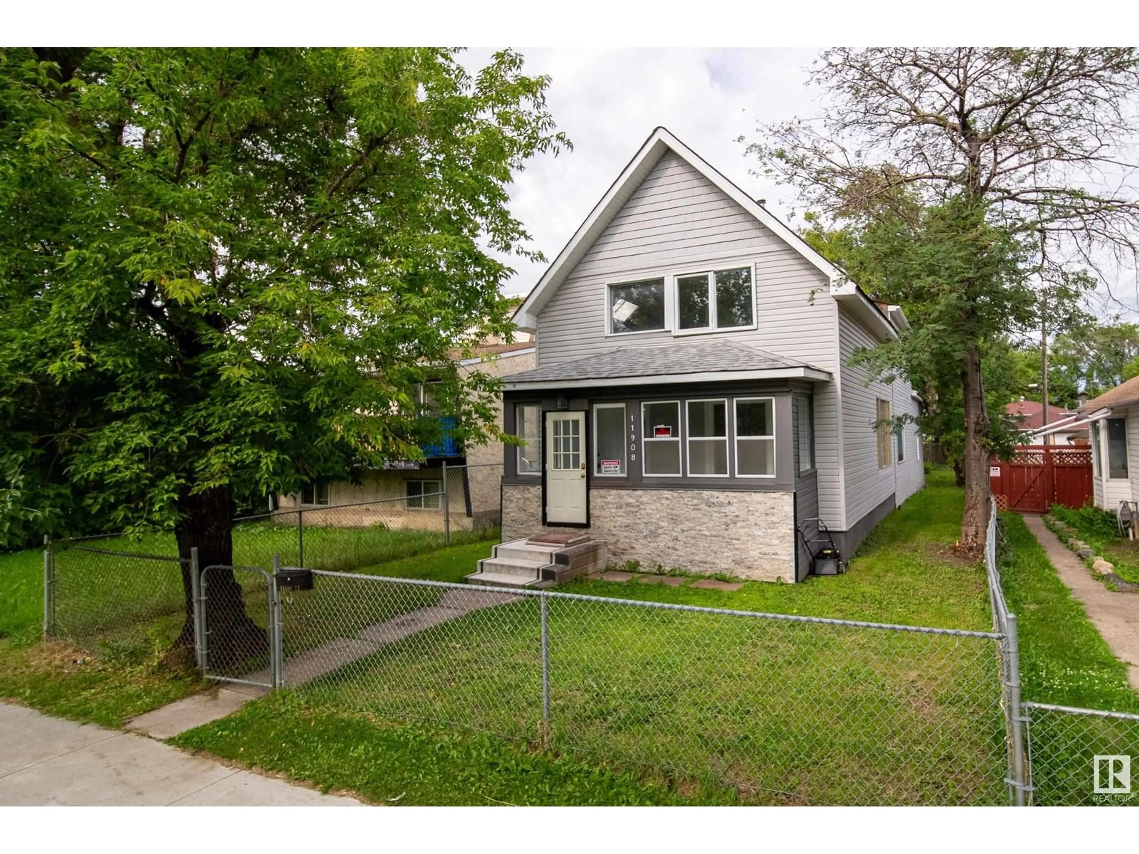 Home with vinyl exterior material, street for NW - 11908 77 ST, Edmonton Alberta T5B2G4