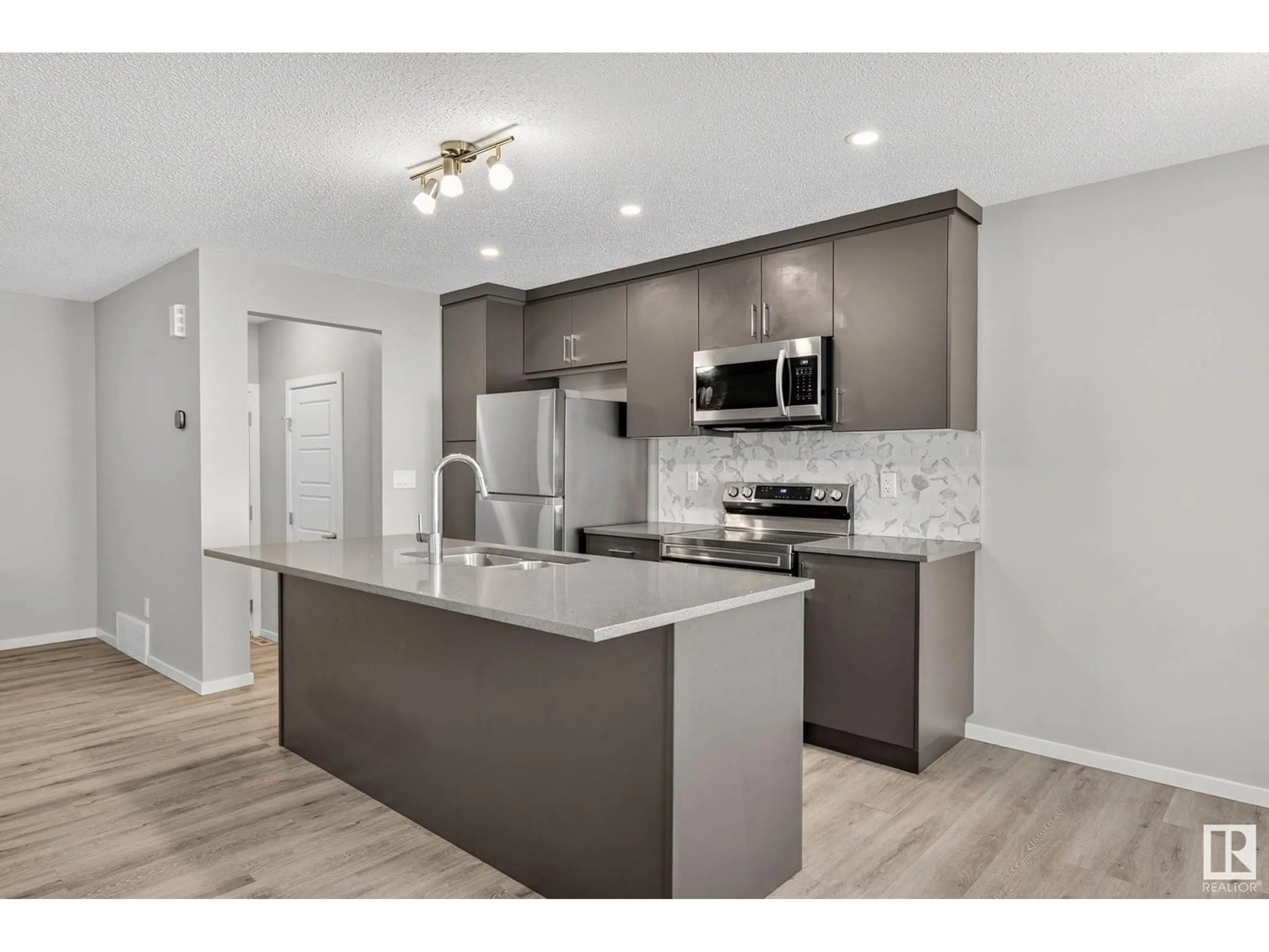 Open concept kitchen, unknown for 20423 21 AV, Edmonton Alberta T6M1M8