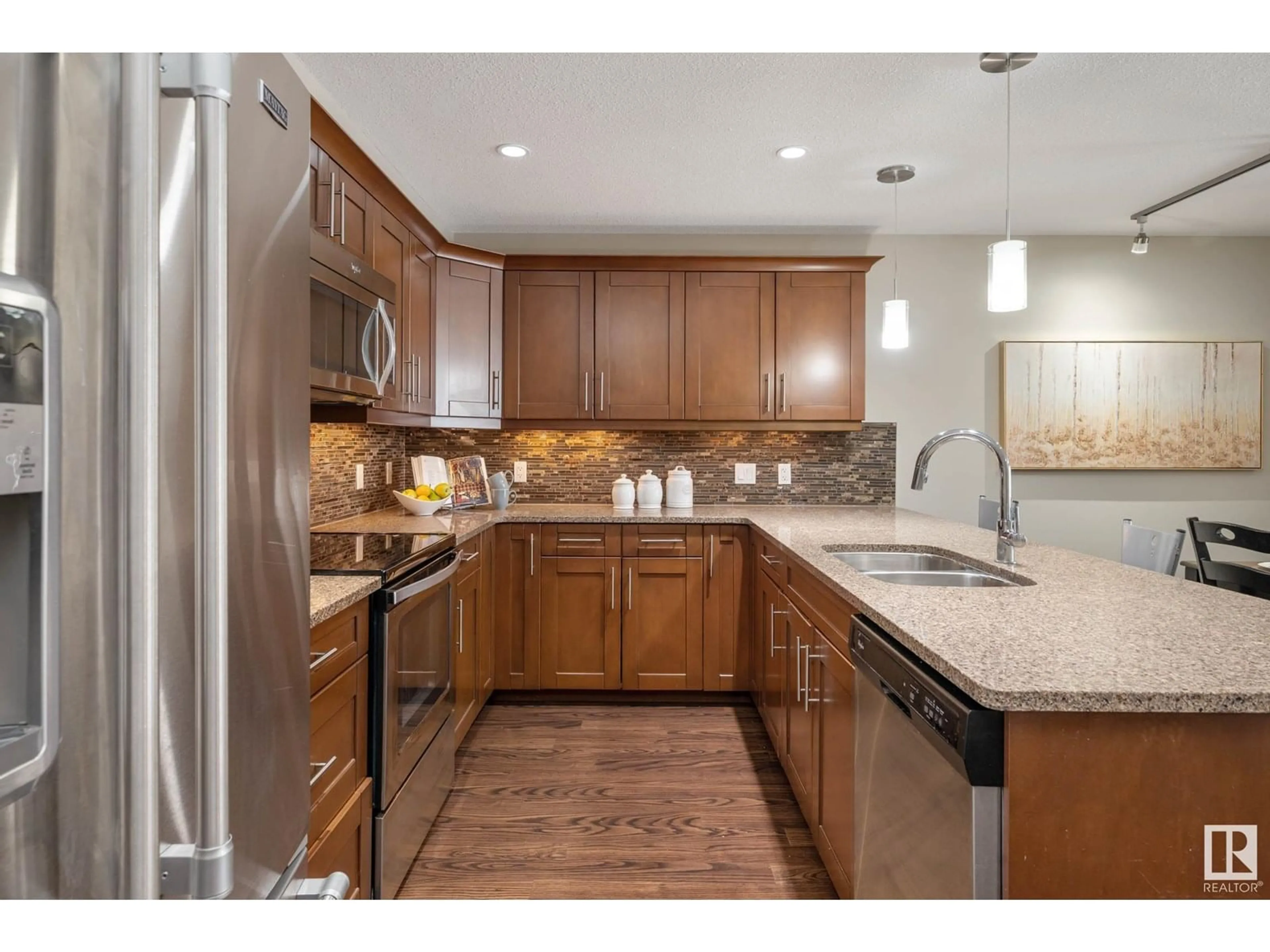 Open concept kitchen, unknown for 119 - 1031 173 ST, Edmonton Alberta T6W3E4