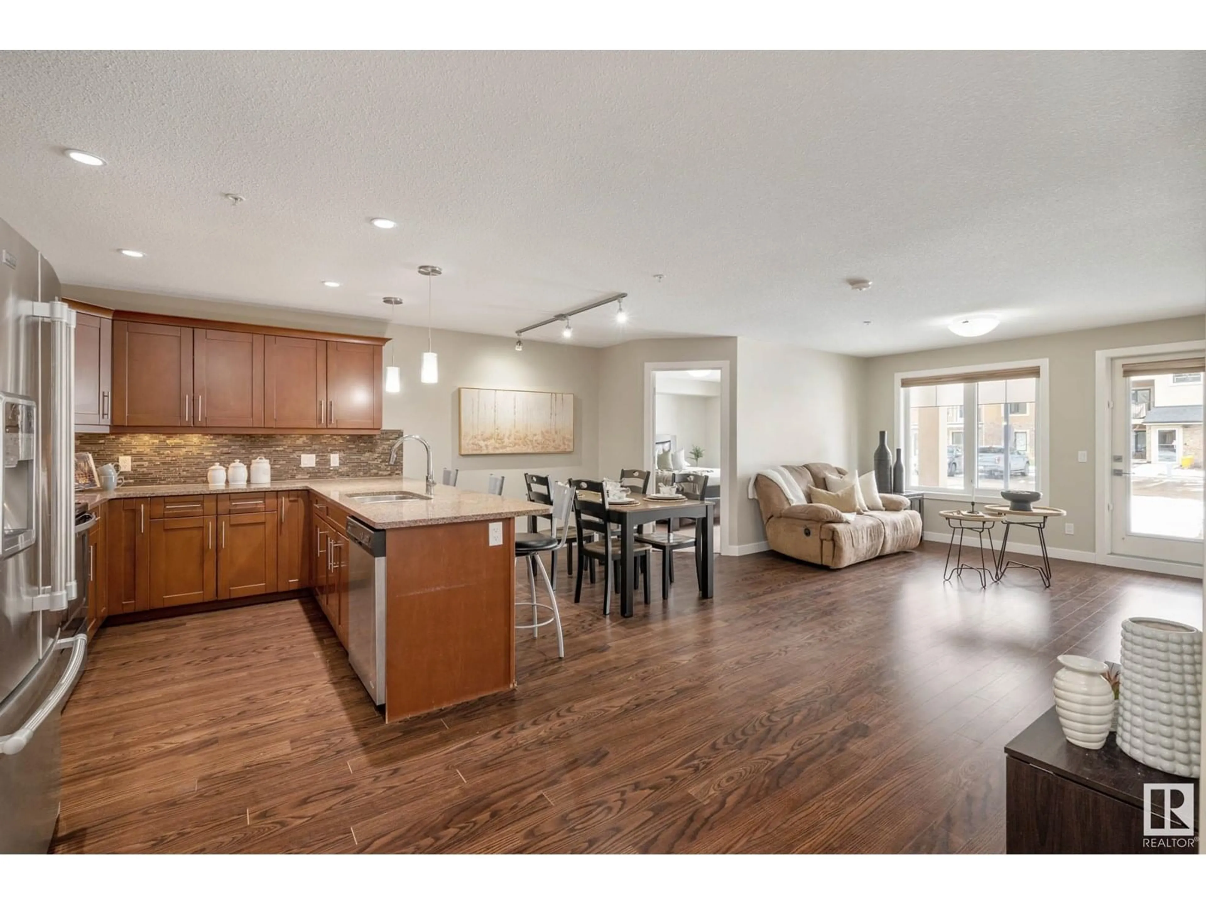 Open concept kitchen, wood/laminate floor for 119 - 1031 173 ST, Edmonton Alberta T6W3E4