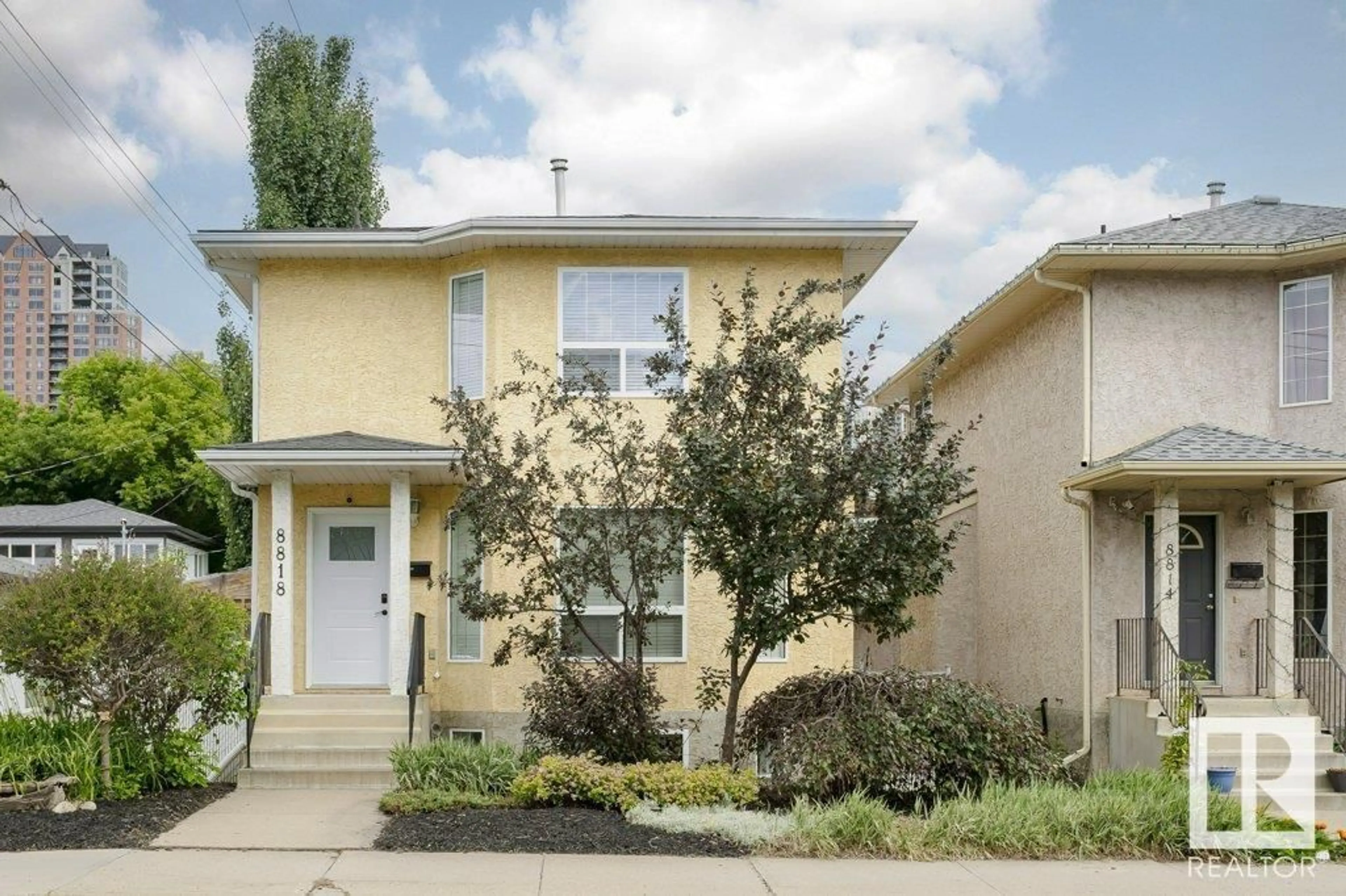 Home with vinyl exterior material, street for 8818 ROWLAND RD, Edmonton Alberta T5H3W4