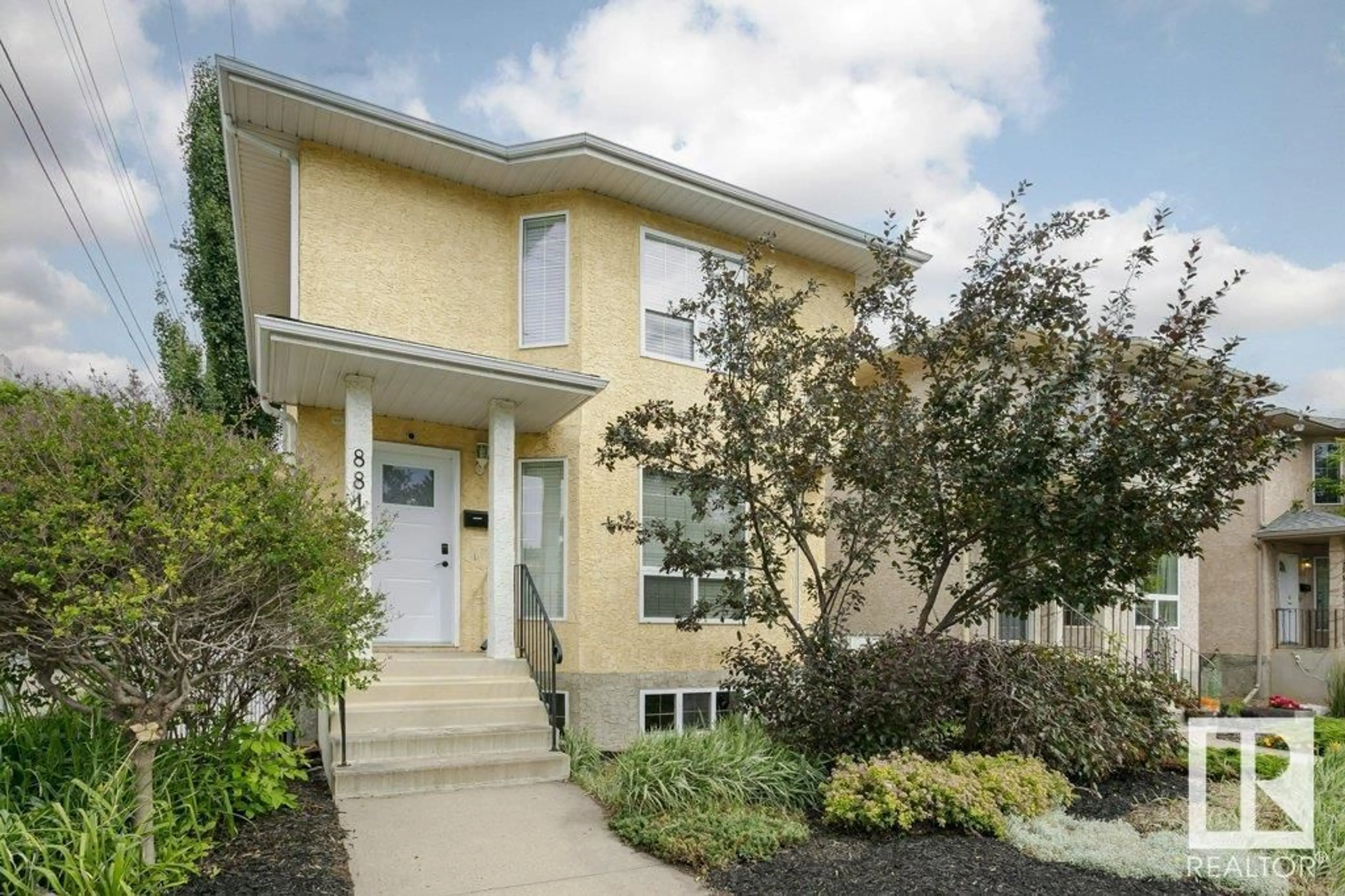 Home with vinyl exterior material, street for 8818 ROWLAND RD, Edmonton Alberta T5H3W4