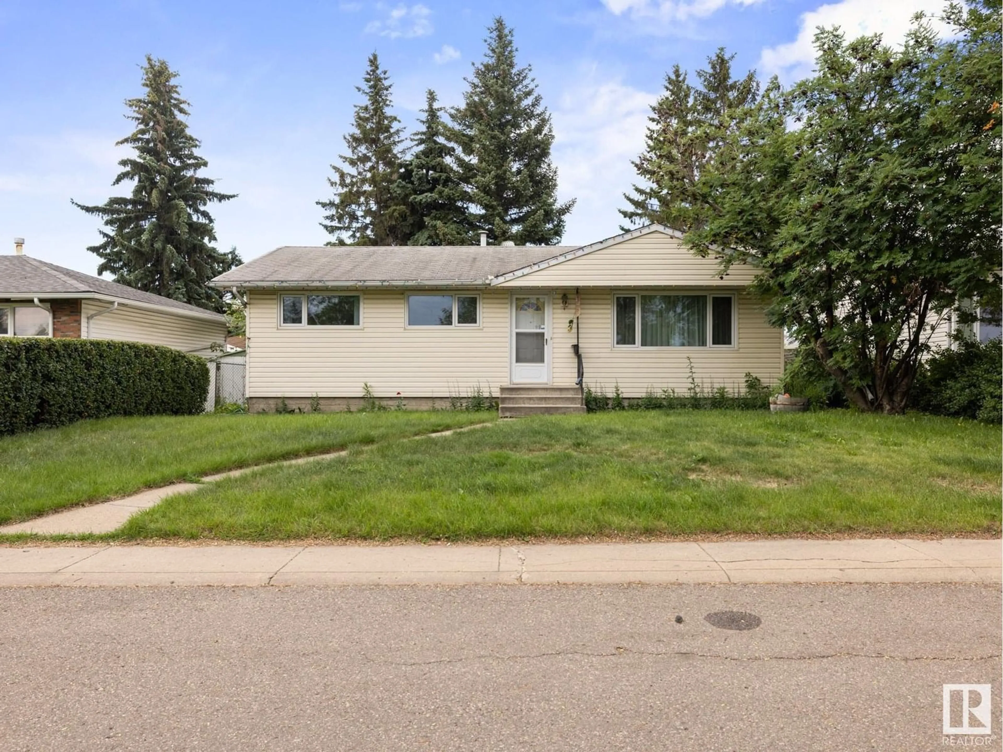 Home with vinyl exterior material, street for 5907 137 AV, Edmonton Alberta T5A0P1
