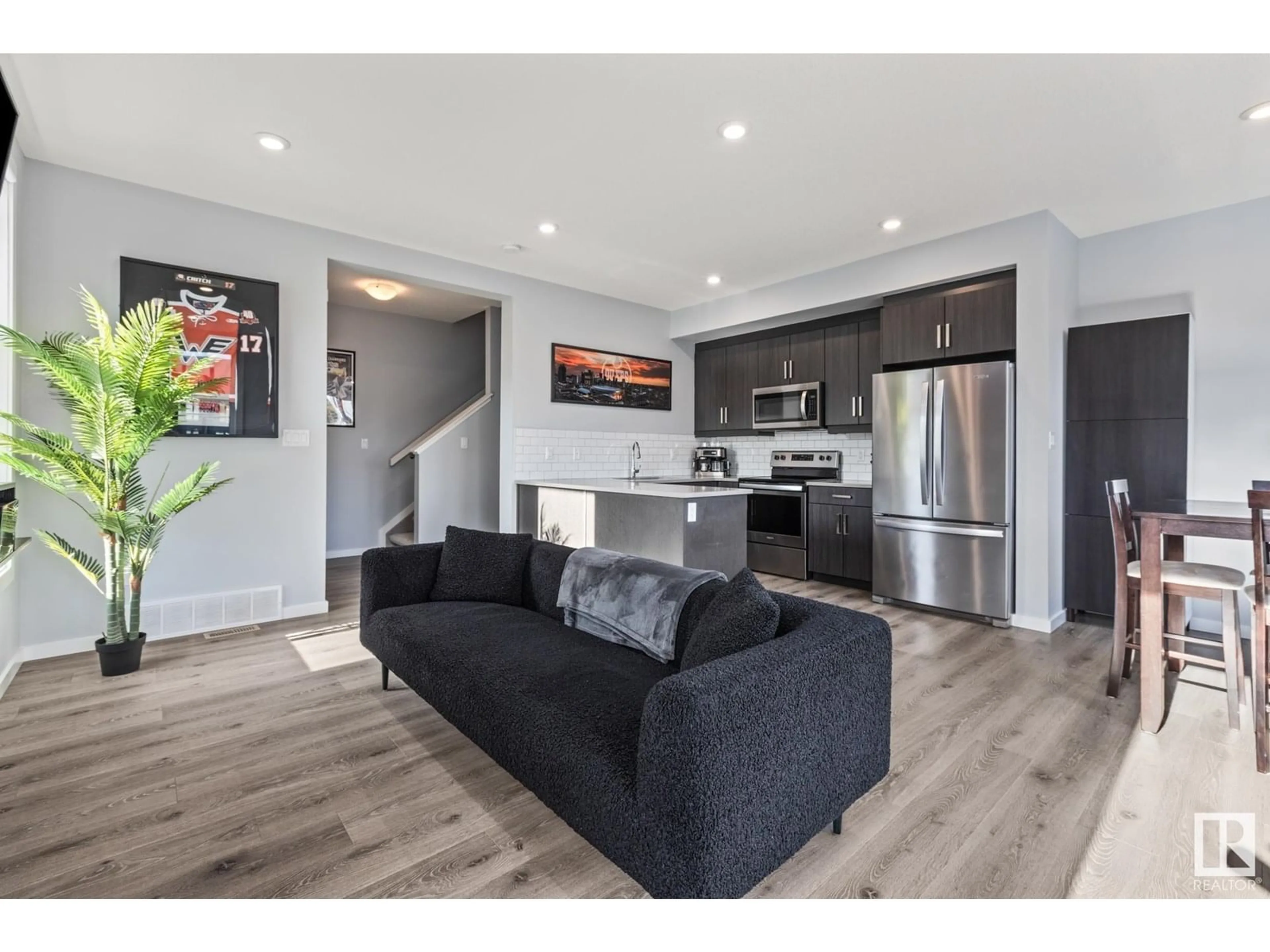 Open concept kitchen, wood/laminate floor for #106 - 1304 RUTHERFORD RD, Edmonton Alberta T6W0B4