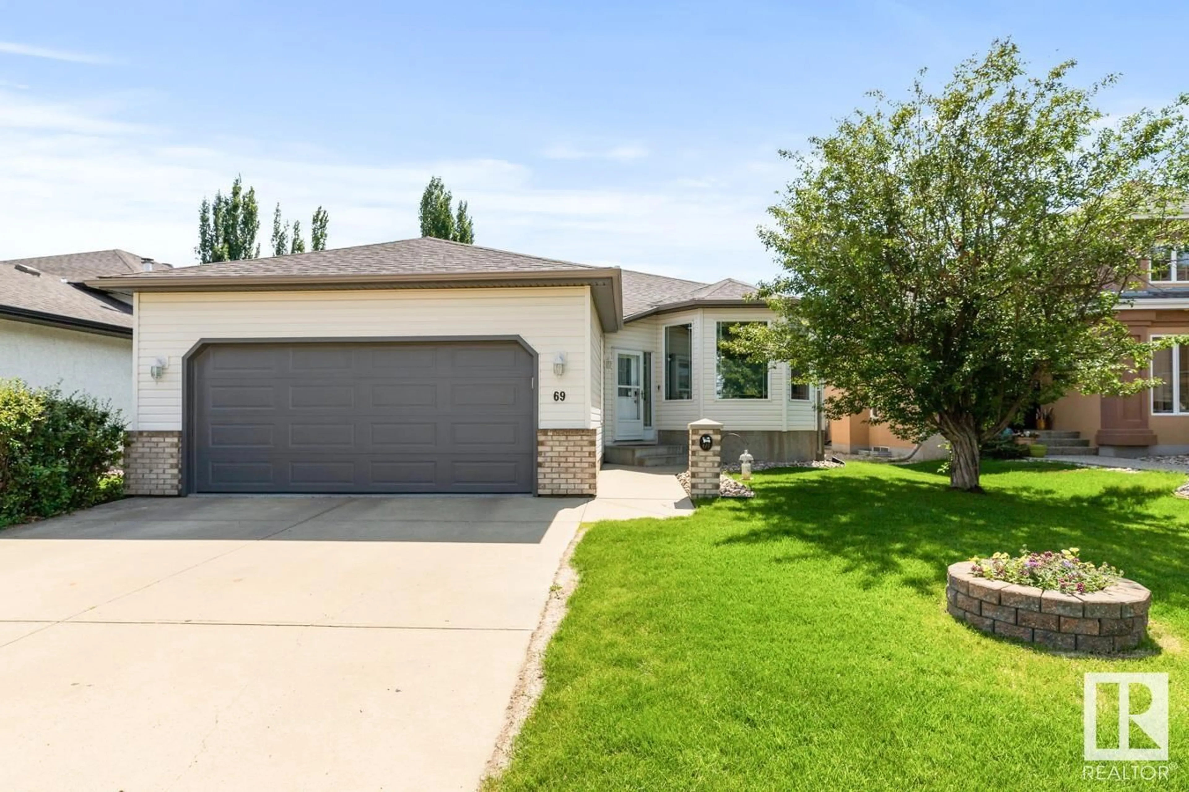 Home with vinyl exterior material, street for 69 COLONIALE WY, Beaumont Alberta T4X1M3