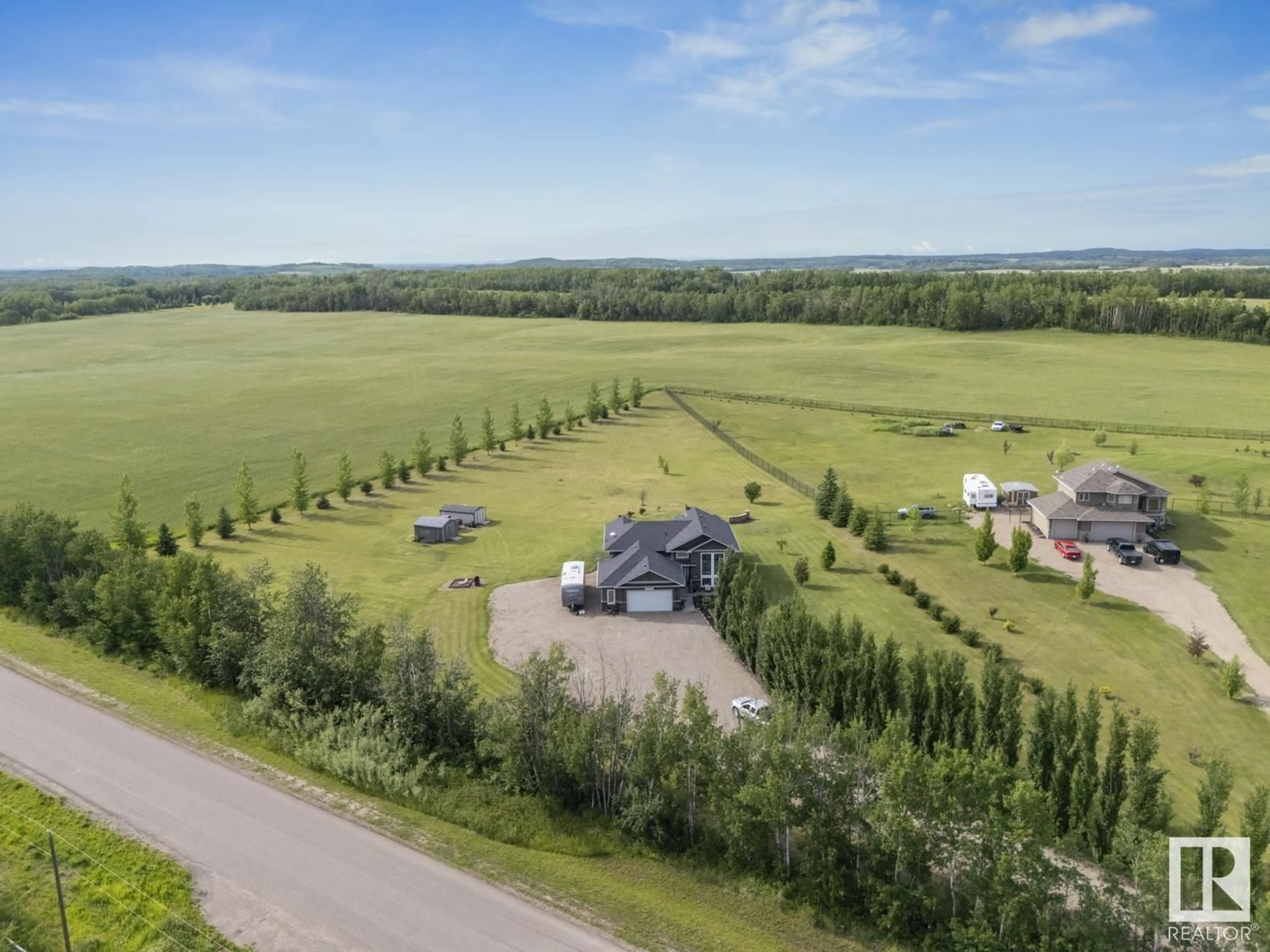 A pic from outside/outdoor area/front of a property/back of a property/a pic from drone, mountain view for 4 TWP RD 624, Rural Bonnyville M.D. Alberta T9M1P3