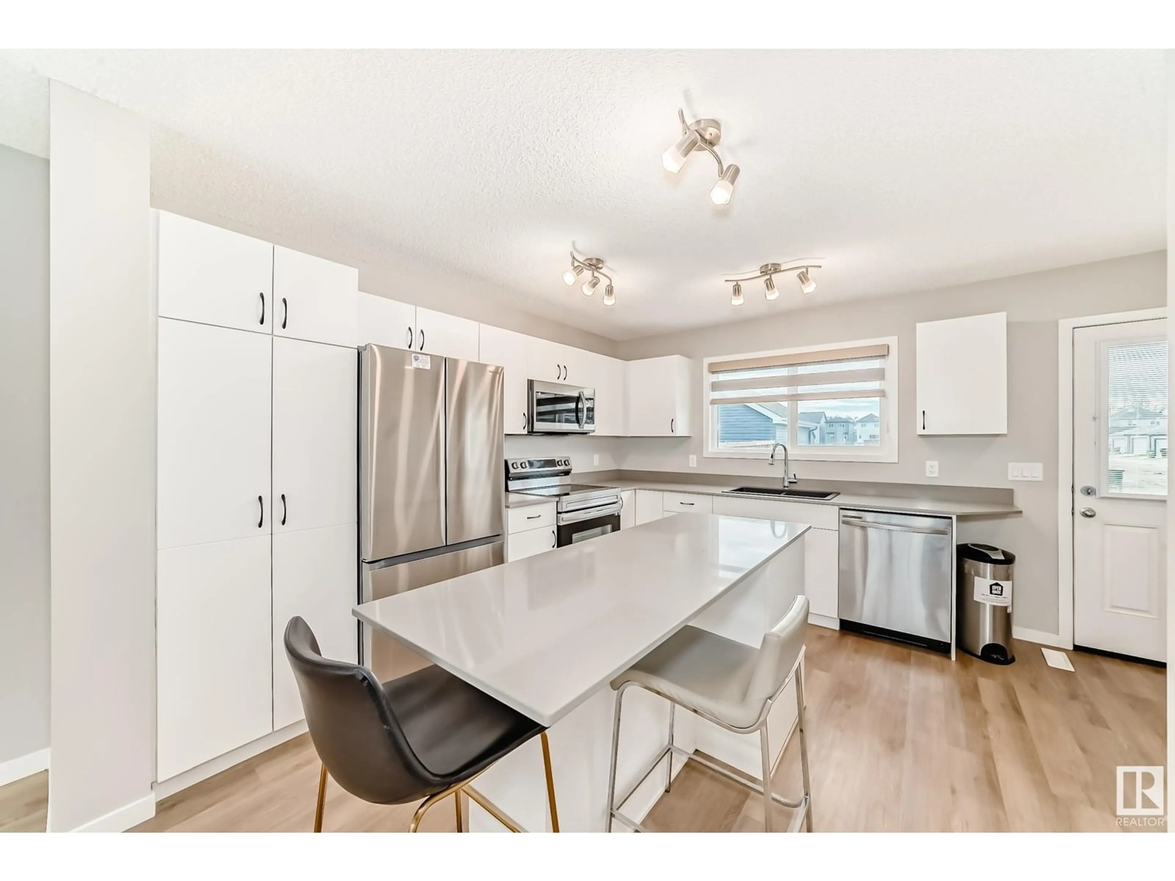 Open concept kitchen, unknown for 6311 176 AV, Edmonton Alberta T5Y4E5
