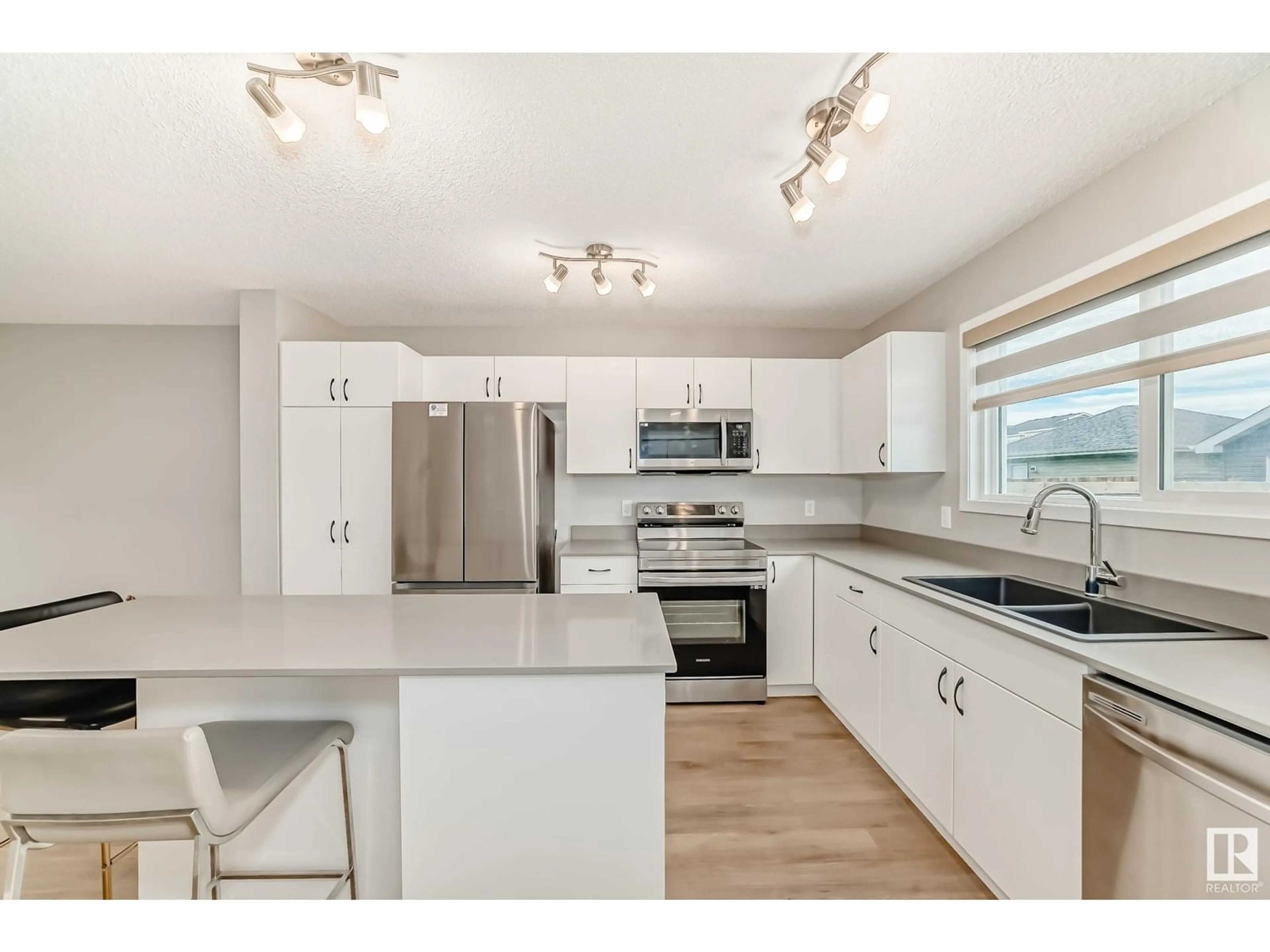 Open concept kitchen, unknown for 6311 176 AV, Edmonton Alberta T5Y4E5