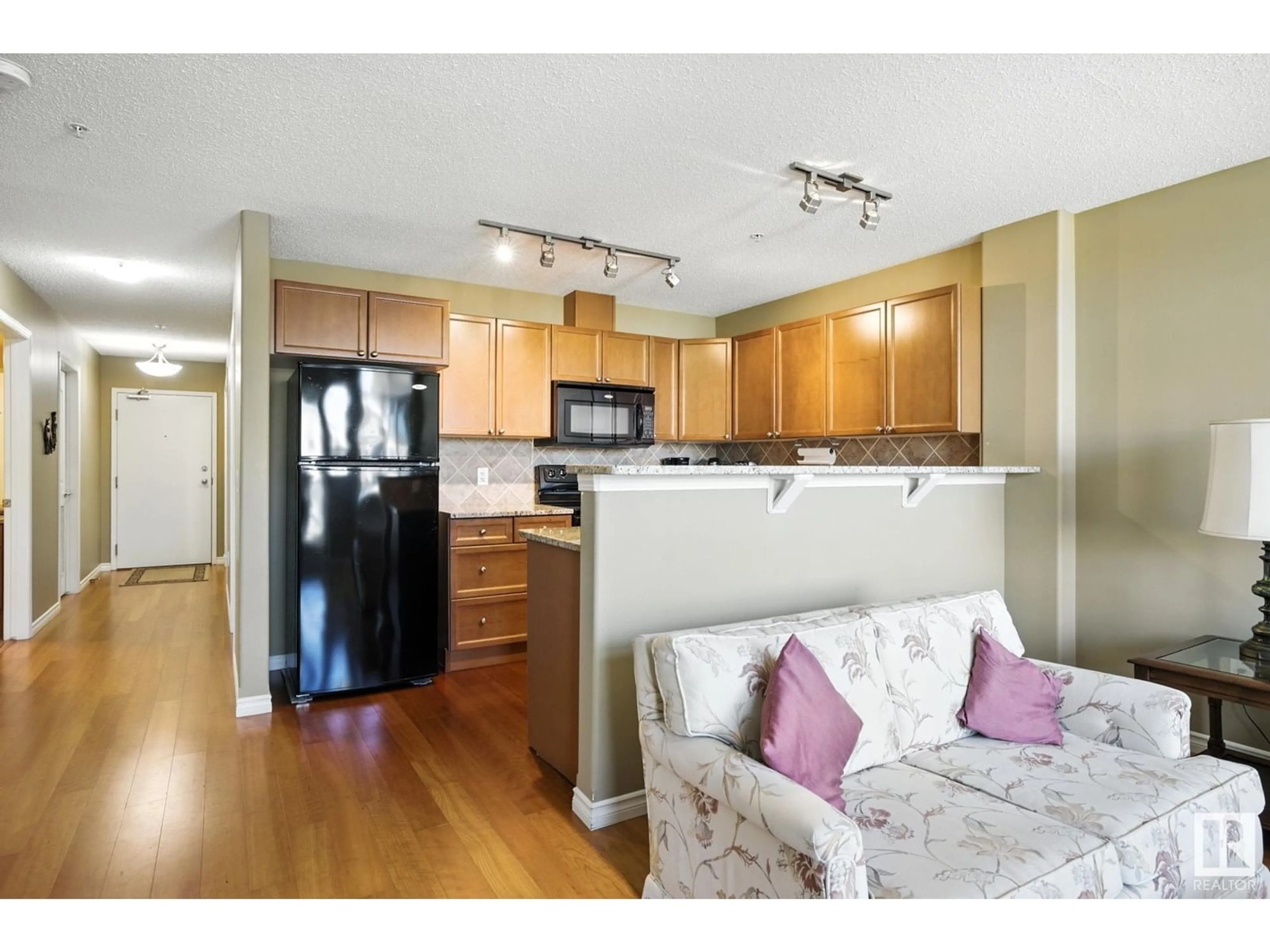 Open concept kitchen, wood/laminate floor for #407 - 141 FESTIVAL WY, Sherwood Park Alberta T8A3V8