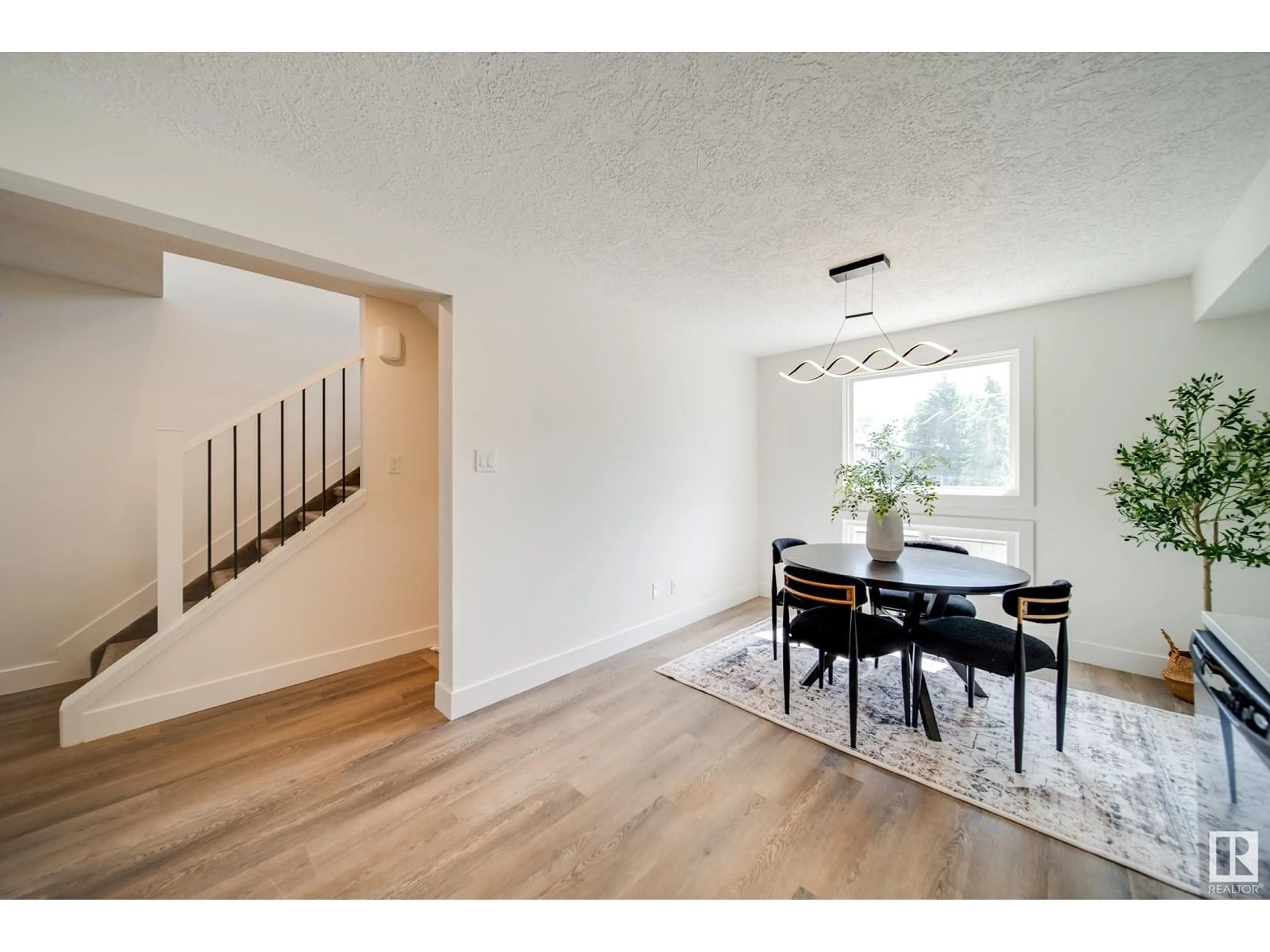 Dining room, wood/laminate floor for NW - 13888 24 ST, Edmonton Alberta T5Y1B6