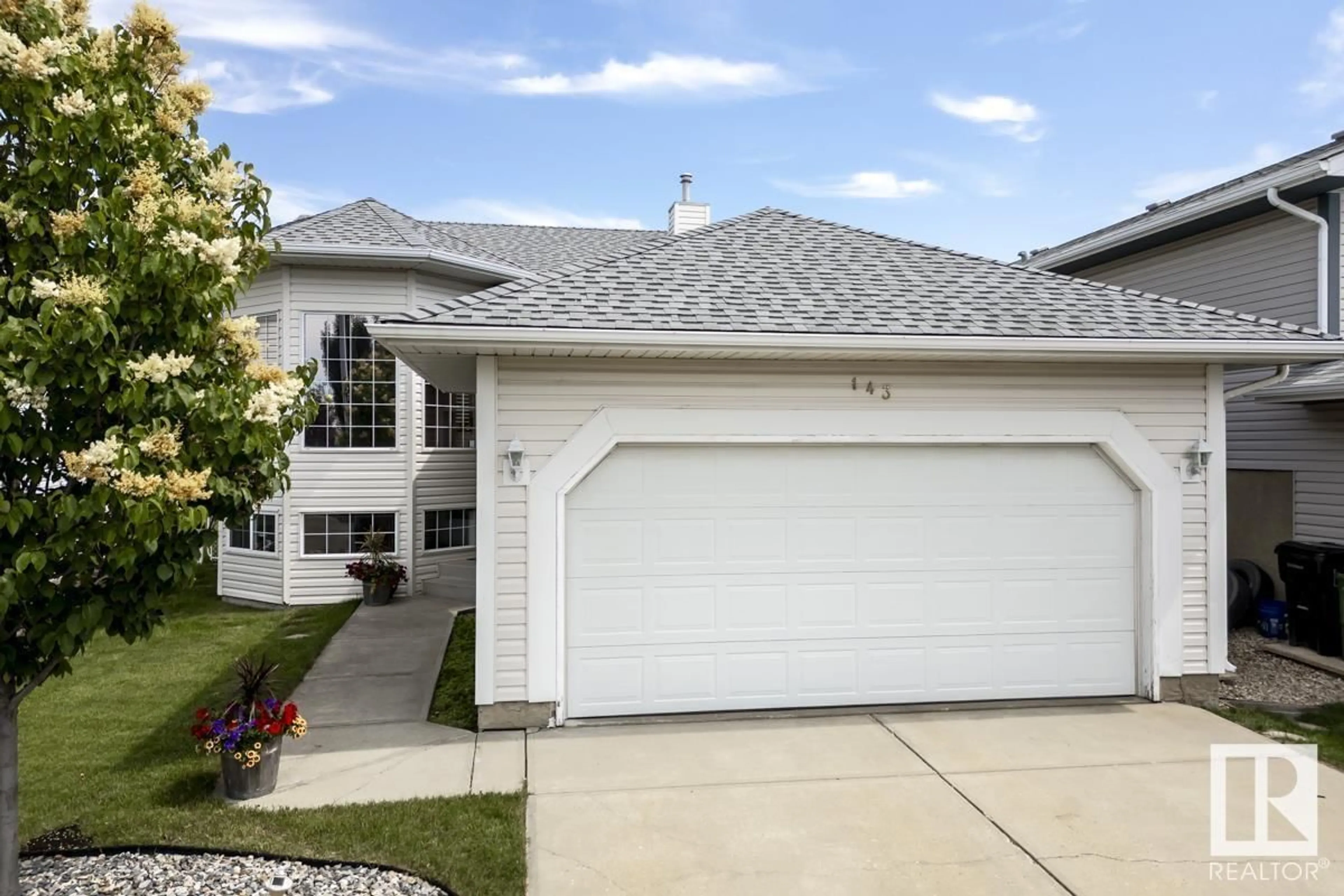 Home with vinyl exterior material, street for 143 HOLLICK-KENYON WY, Edmonton Alberta T5Y2V7