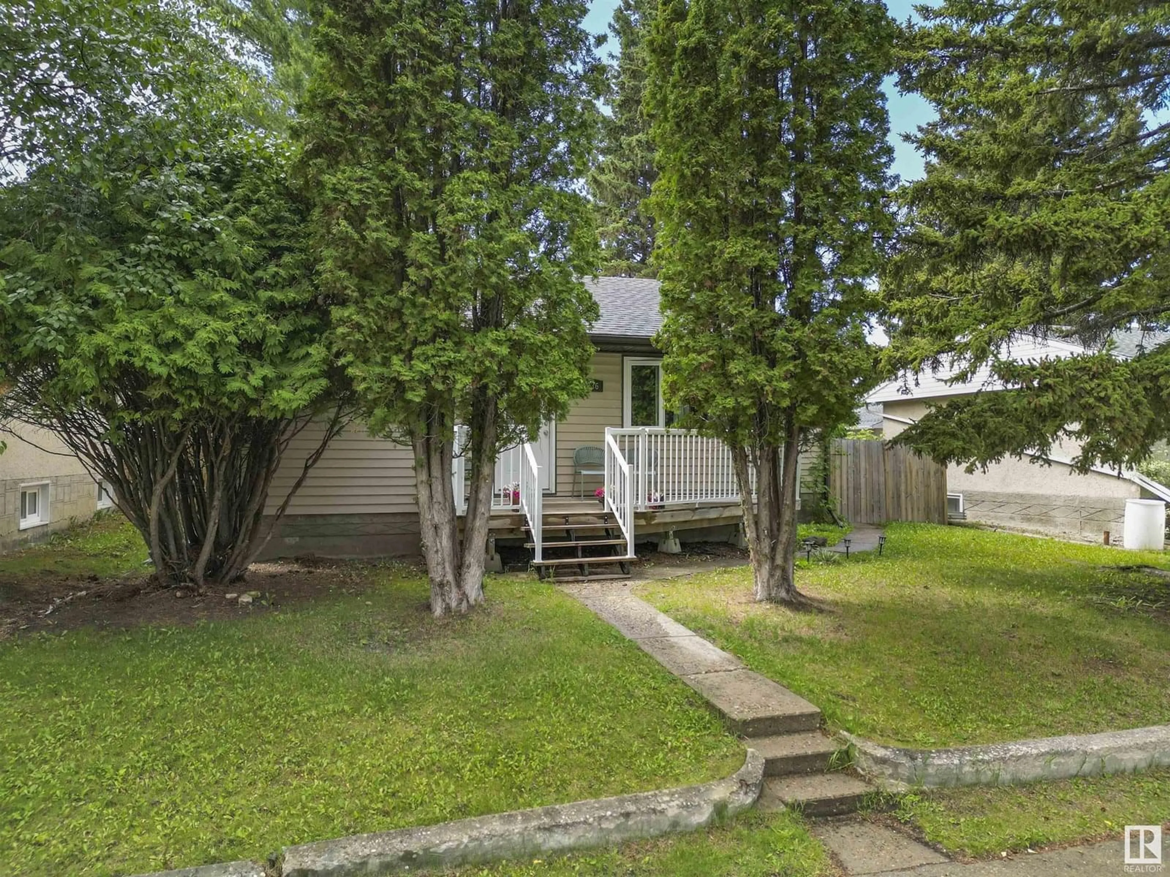 A pic from outside/outdoor area/front of a property/back of a property/a pic from drone, forest/trees view for 5036 45 STREET, Drayton Valley Alberta T7A1C1