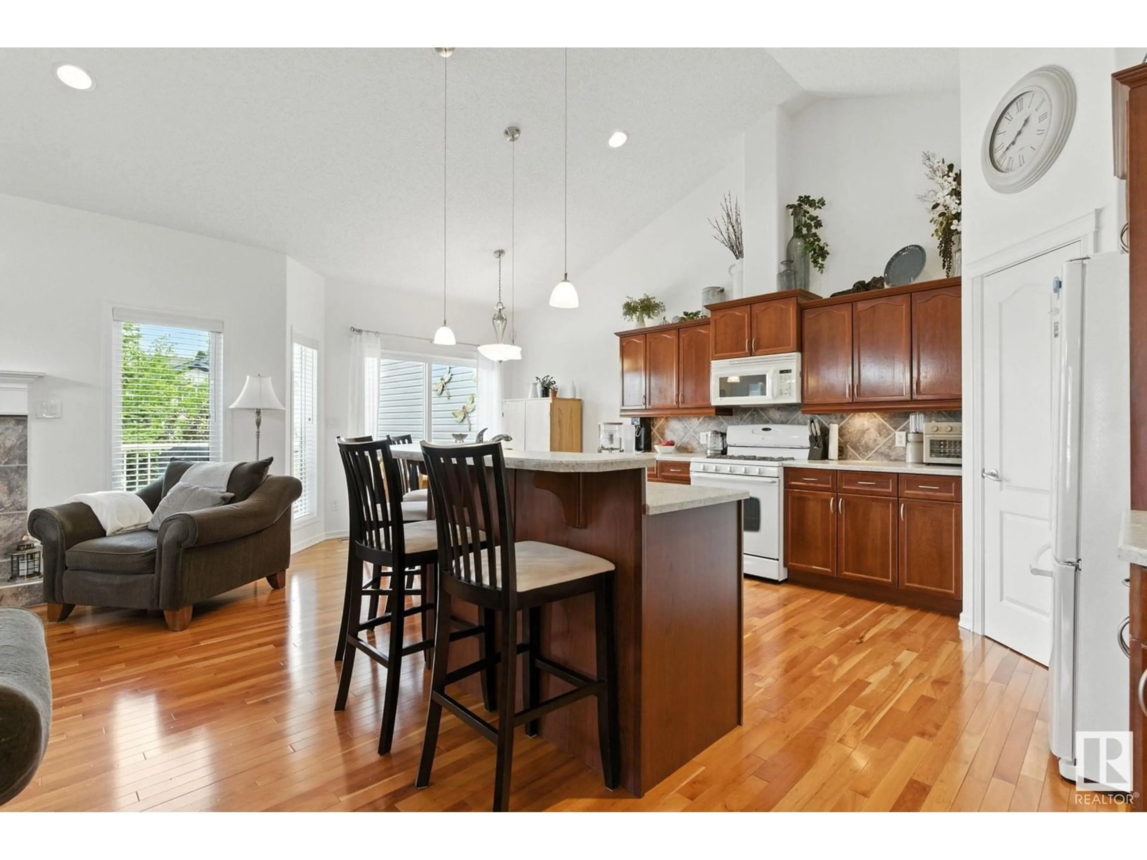 Open concept kitchen, wood/laminate floor for #35 - 3003 34 AV, Edmonton Alberta T6T0A1