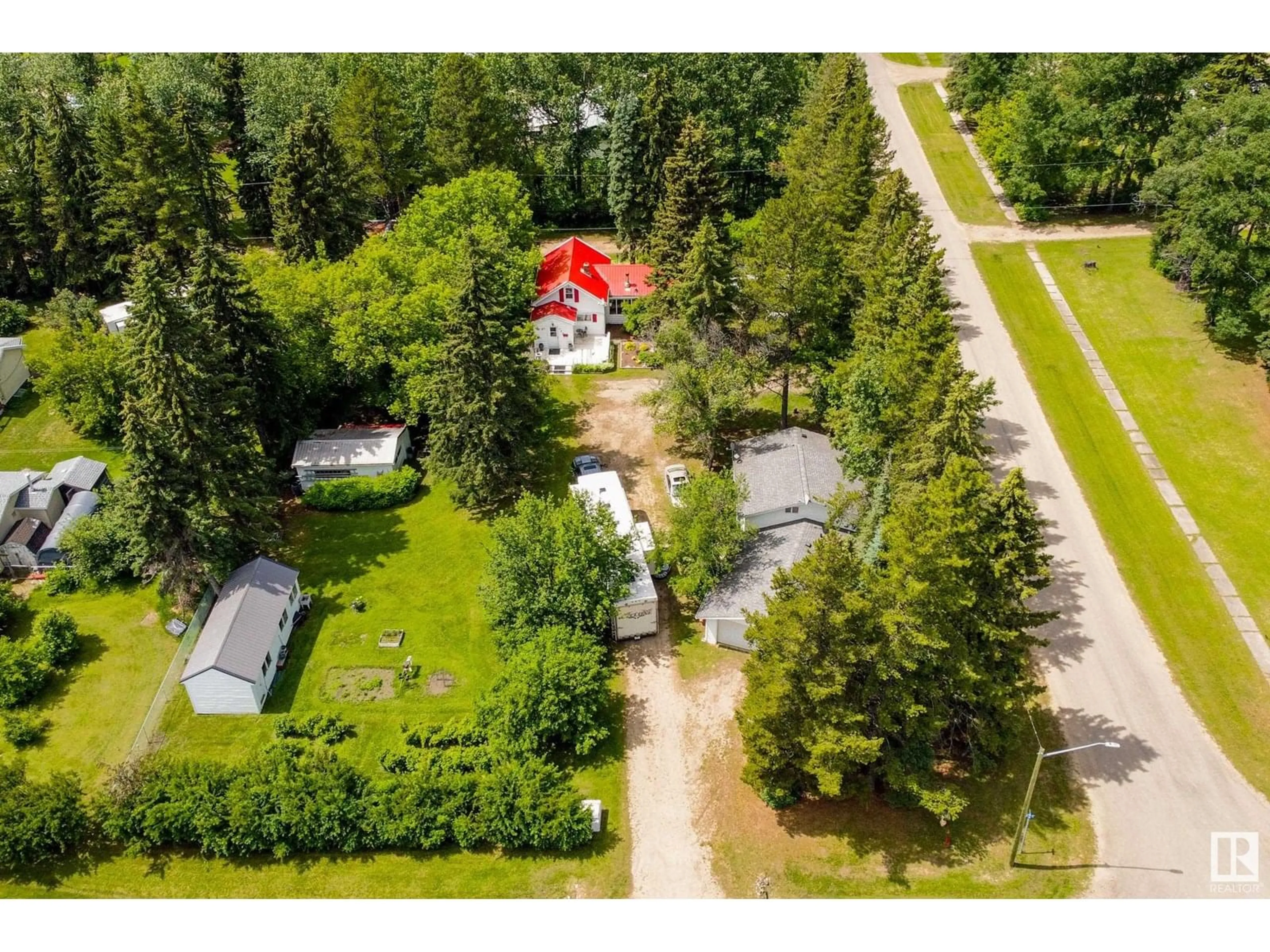 A pic from outside/outdoor area/front of a property/back of a property/a pic from drone, unknown for E - 305 3 ST, Winfield Alberta T0C2X0