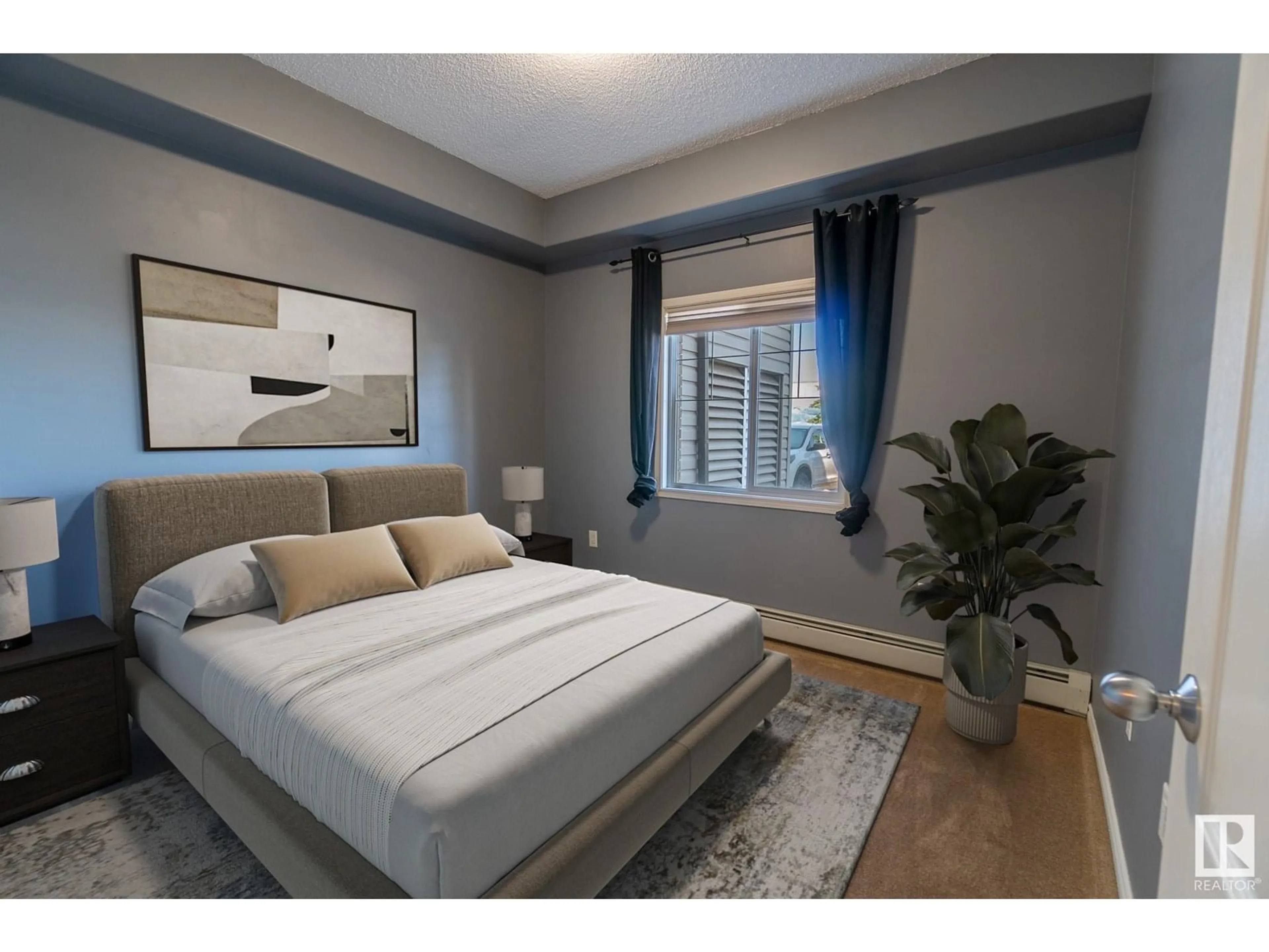 Bedroom with bed, wood/laminate floor for 118 16807 100 AV NW, Edmonton Alberta T5P4Z6