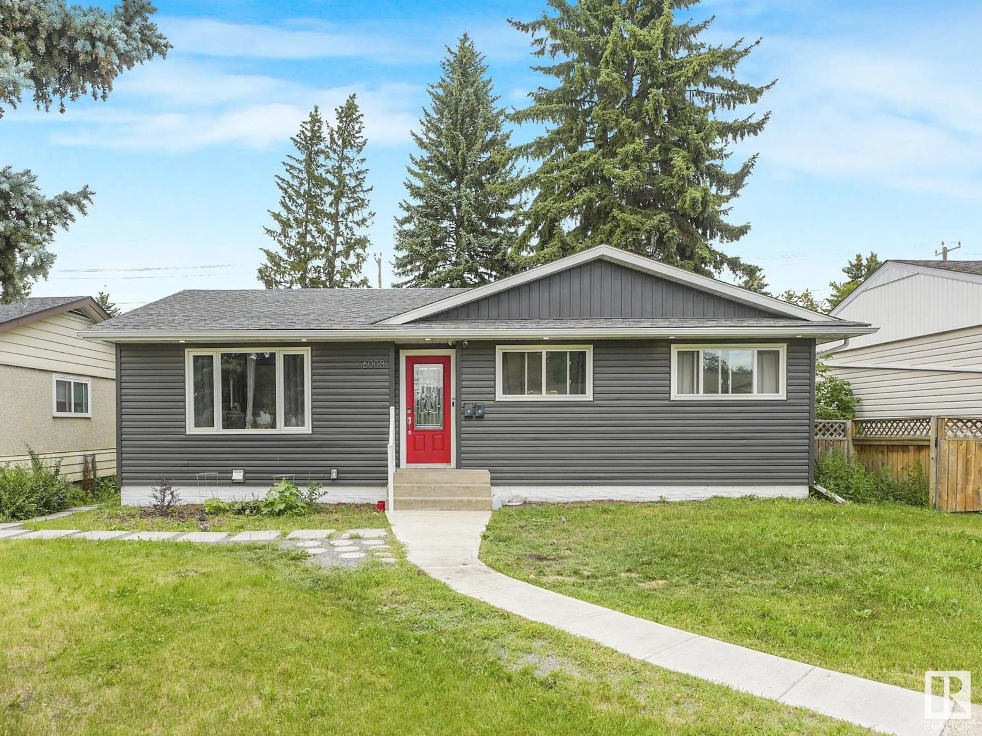 Home with vinyl exterior material, street for 6008 101A AV, Edmonton Alberta T6A0M1