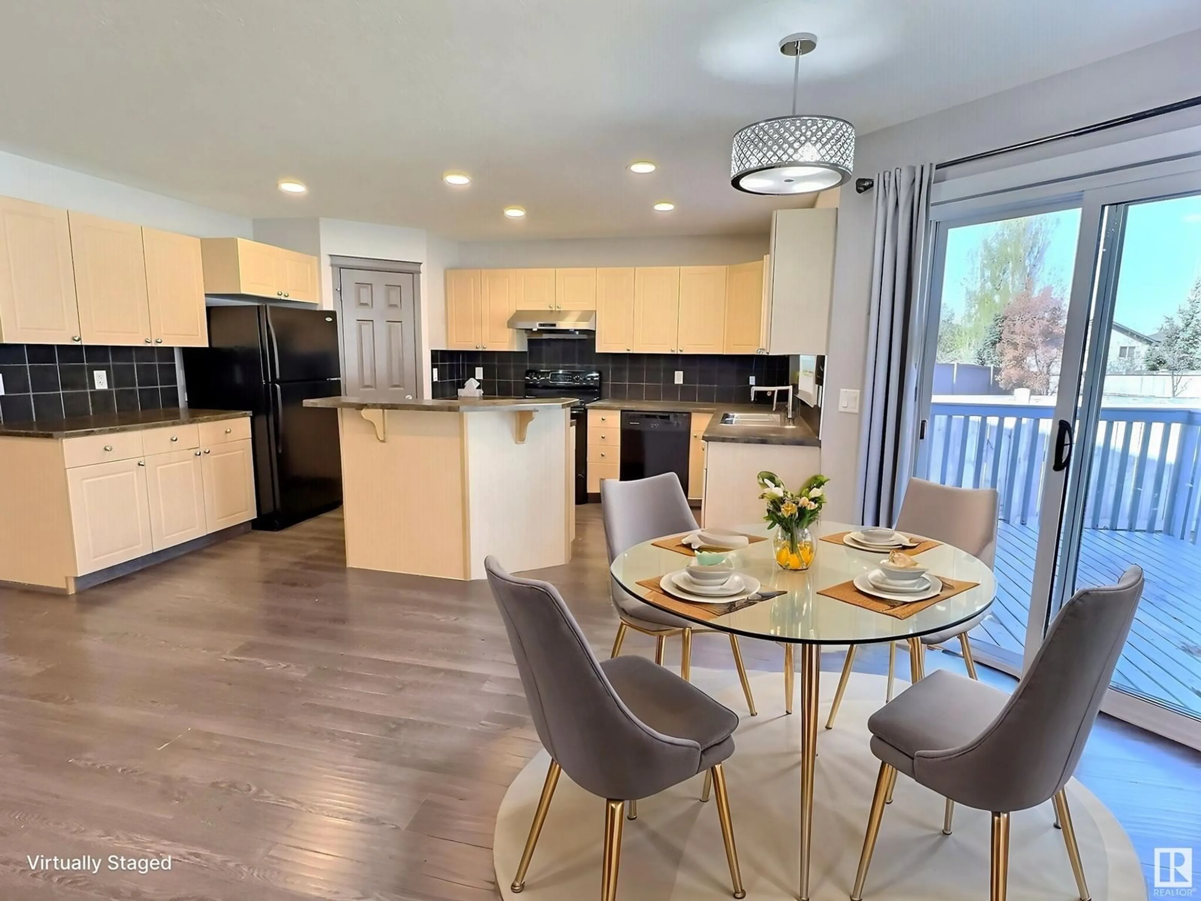 Open concept kitchen, wood/laminate floor for 8736 178 AV, Edmonton Alberta T5Z0B8
