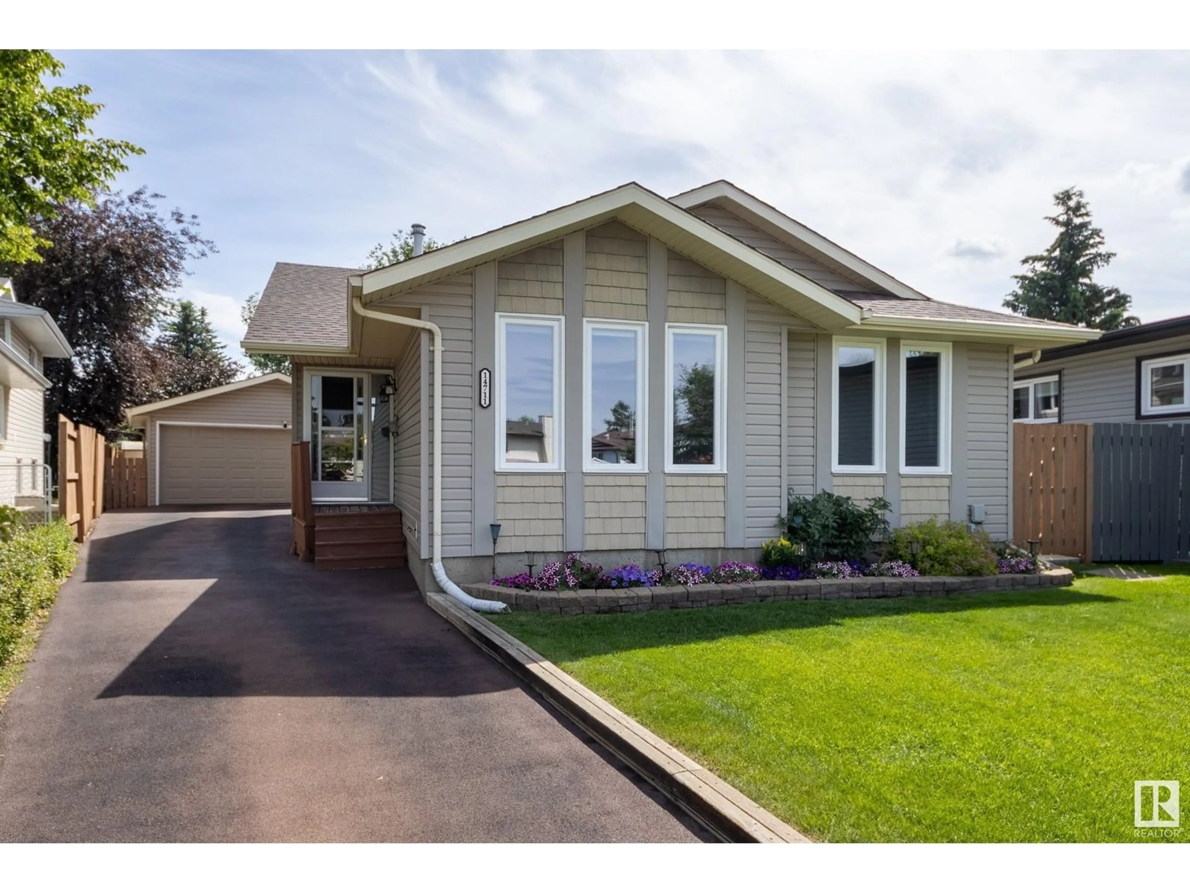 Home with vinyl exterior material, street for 14711 29A ST, Edmonton Alberta T5Y2E4