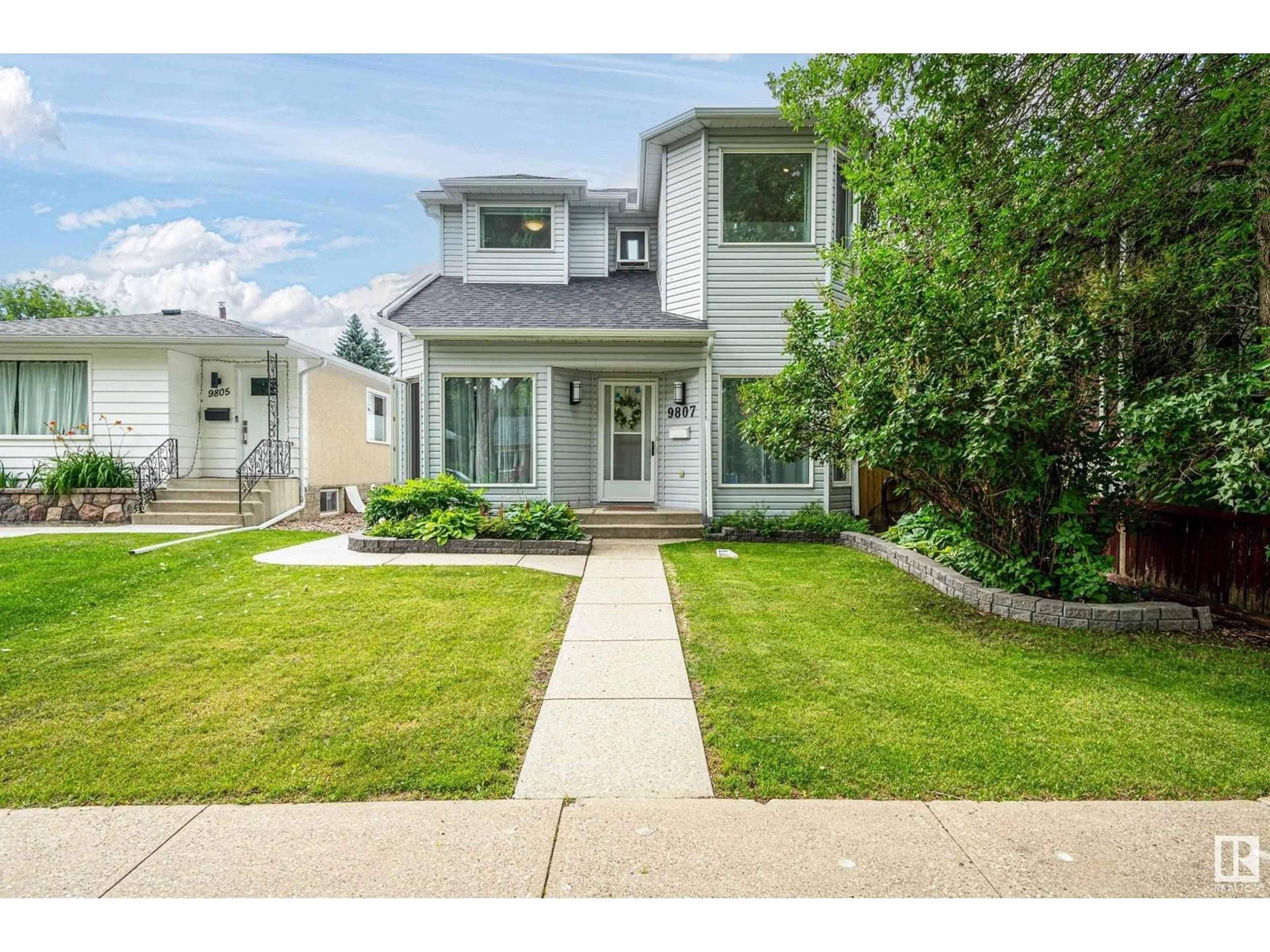Home with vinyl exterior material, street for 9807 80 AV, Edmonton Alberta T6E1S9