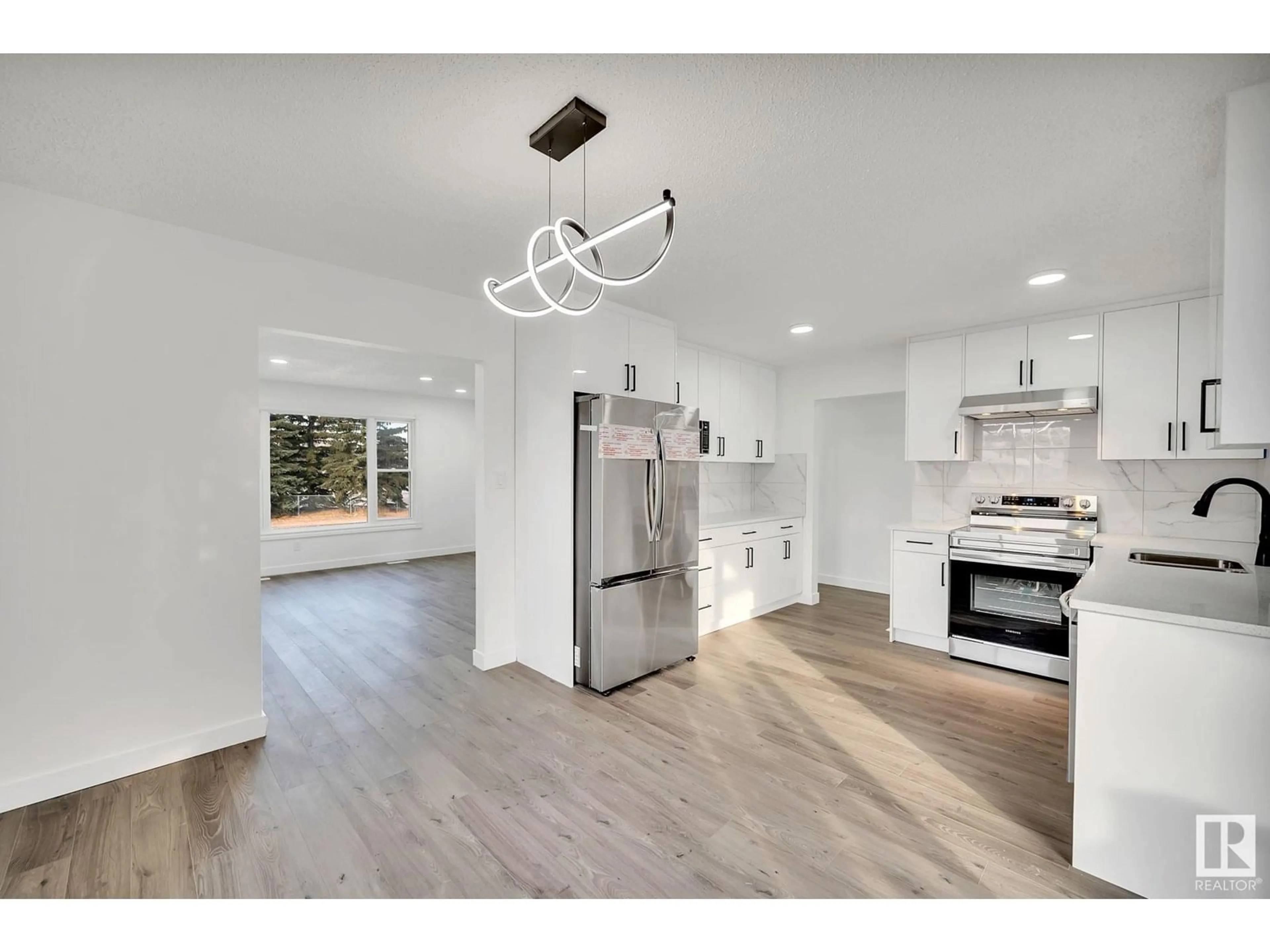 Open concept kitchen, wood/laminate floor for NW - 1350 KNOTTWOOD RD E, Edmonton Alberta T6K2J8