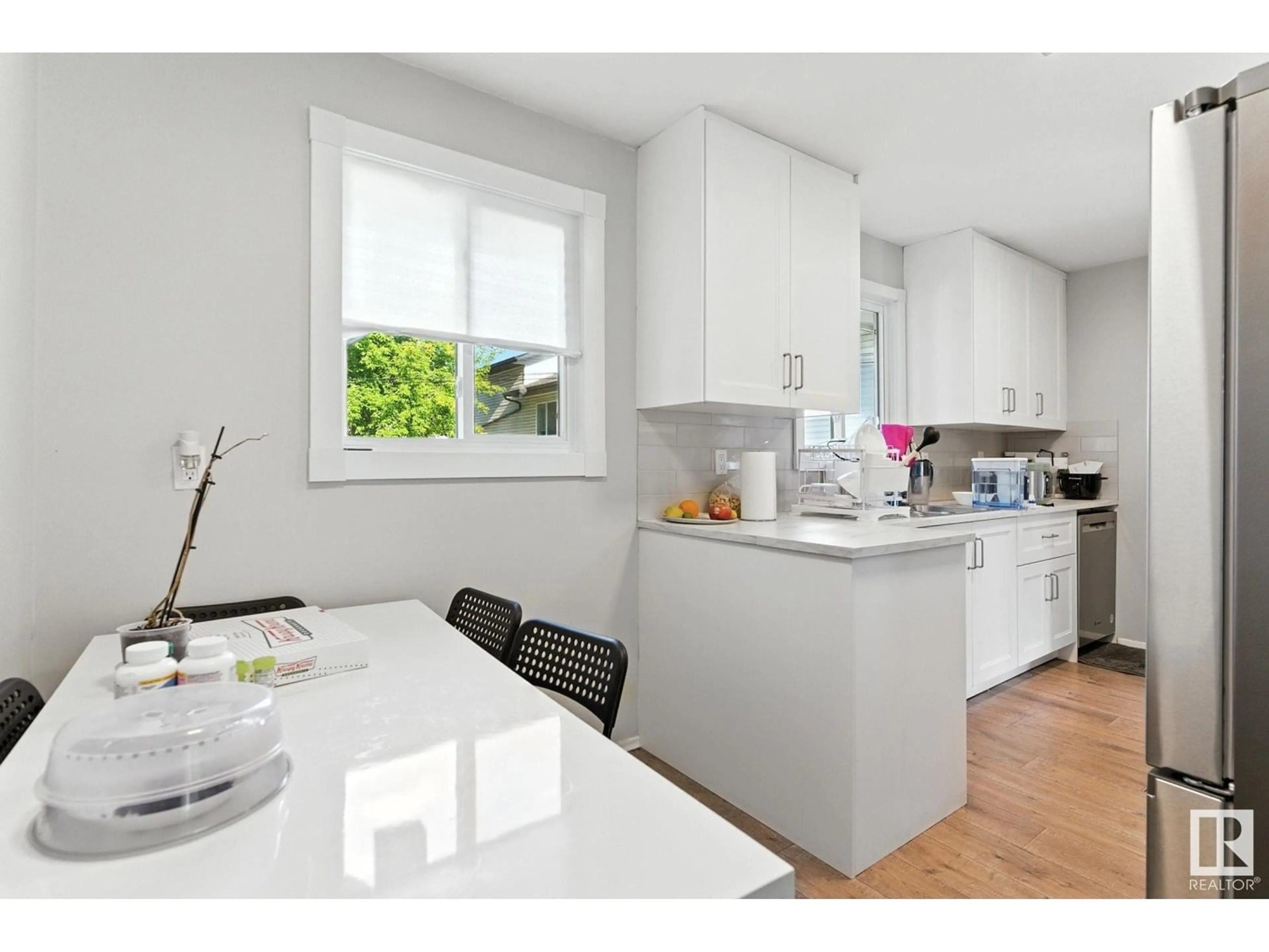 Open concept kitchen, wood/laminate floor for NW - 10505 154 ST, Edmonton Alberta T5P2J1