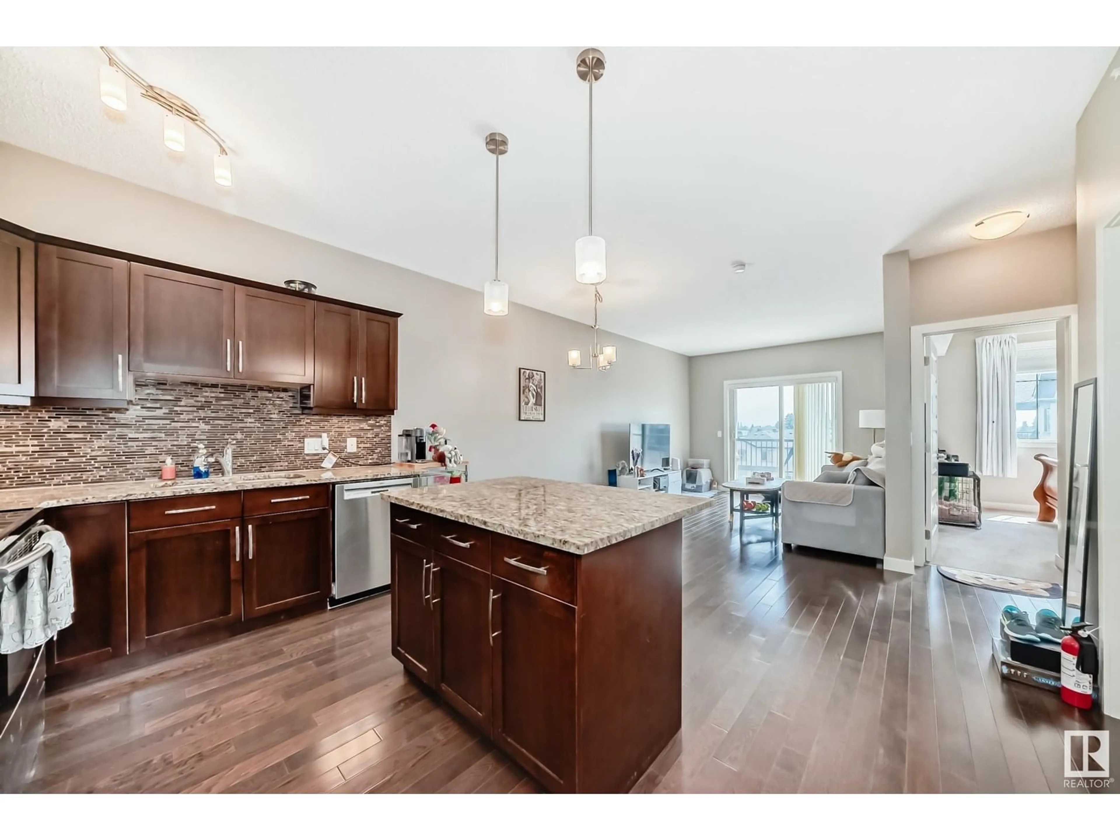 Open concept kitchen, wood/laminate floor for #417 - 10530 56 AV, Edmonton Alberta T6H0X7
