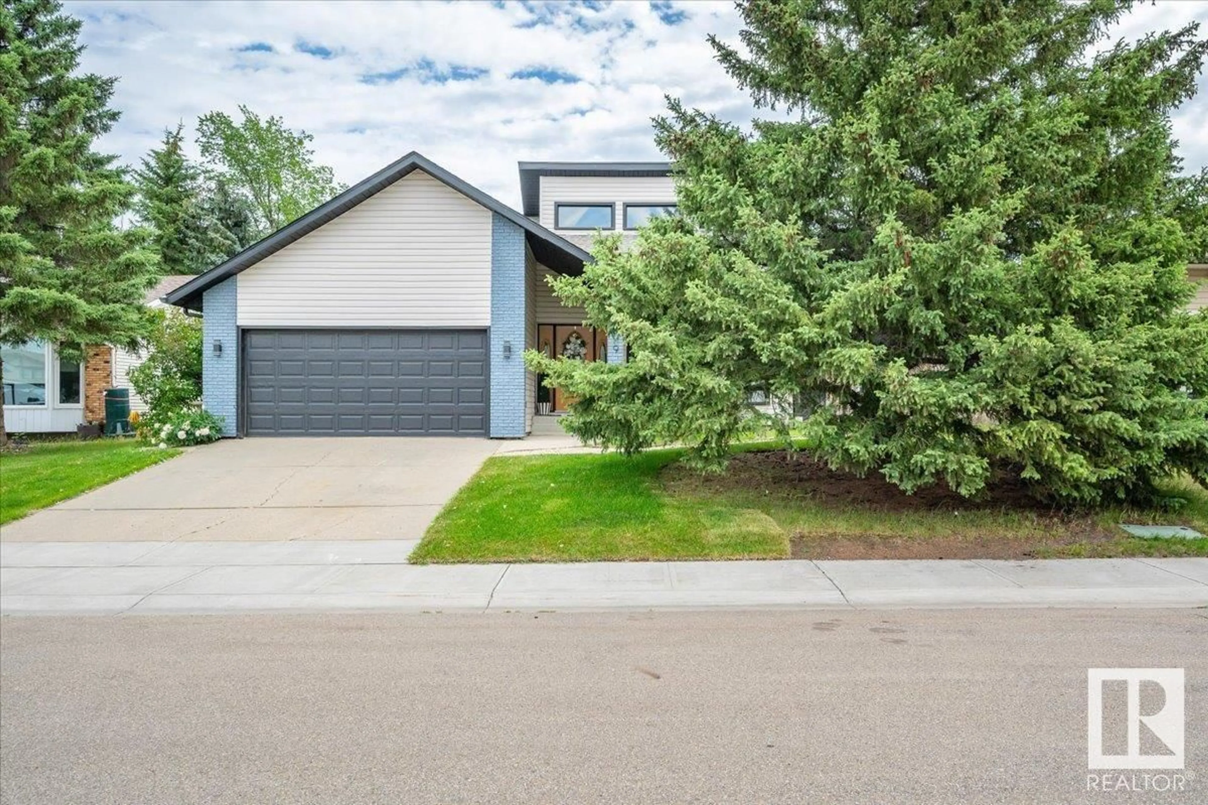 Home with vinyl exterior material, street for 5409 56 ST, Beaumont Alberta T4X1A5