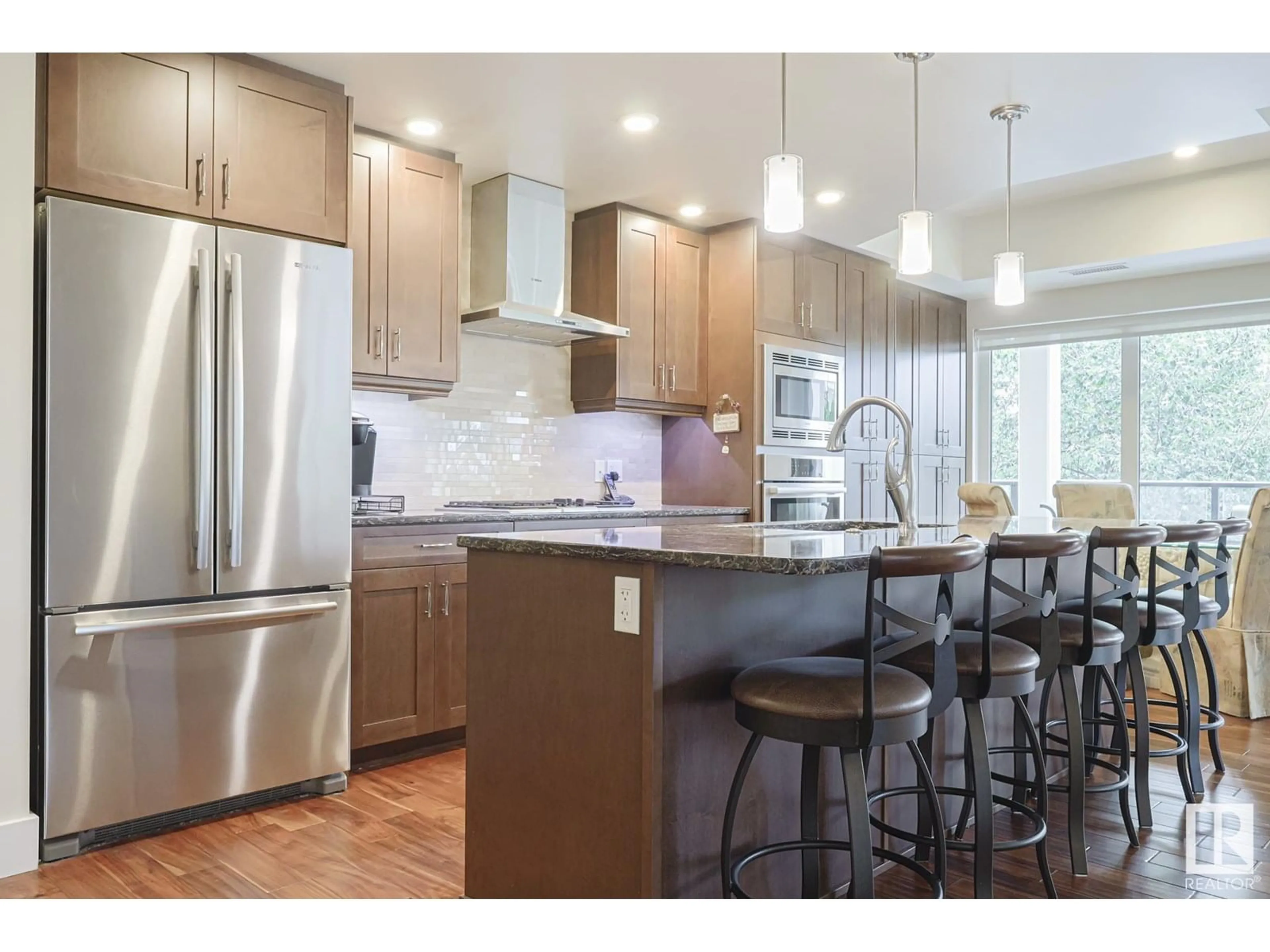 Open concept kitchen, wood/laminate floor for #301 - 200 BELLEROSE DR, St. Albert Alberta T8N7P7