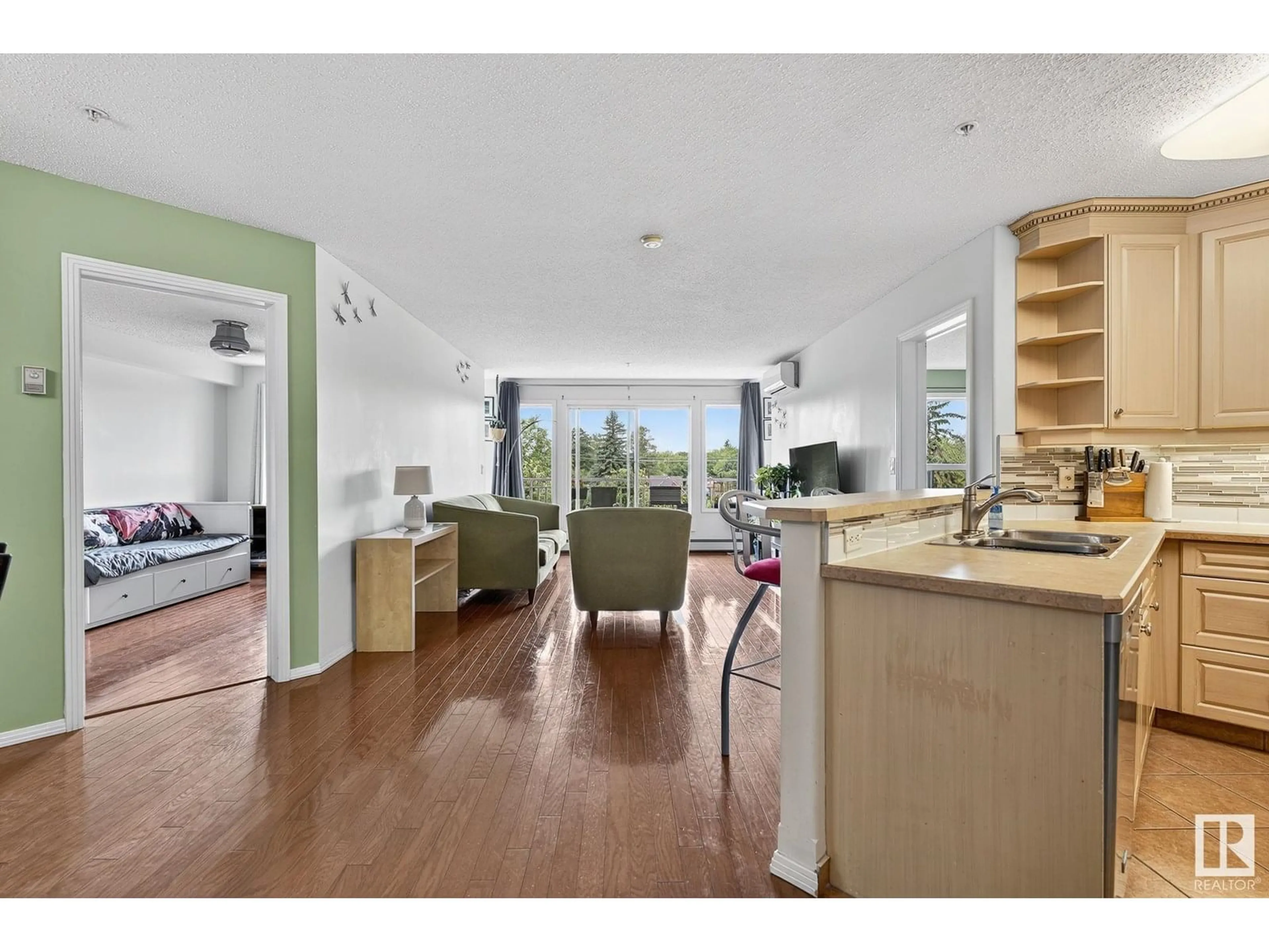 Open concept kitchen, wood/laminate floor for 410 - 10951 124 ST, Edmonton Alberta T5M4E1