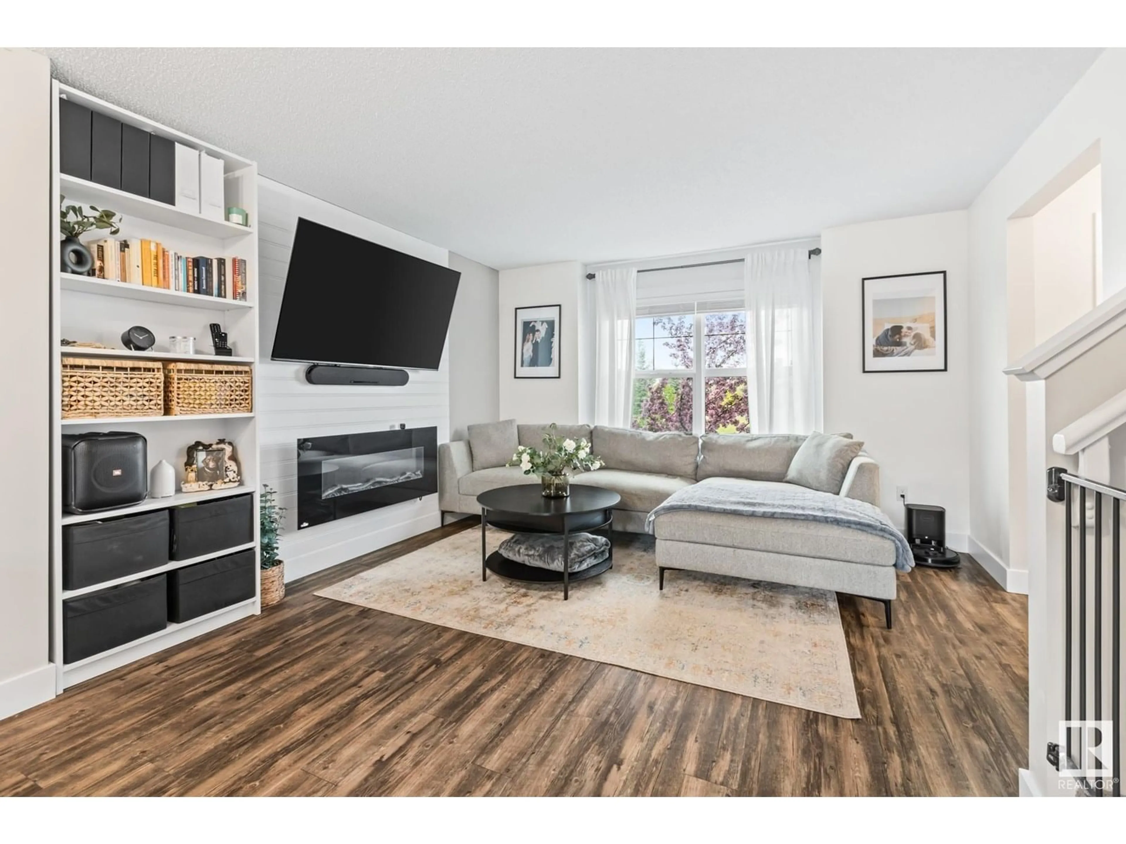 Living room with furniture, wood/laminate floor for 5219 CHAPPELLE RD, Edmonton Alberta T6W2B1