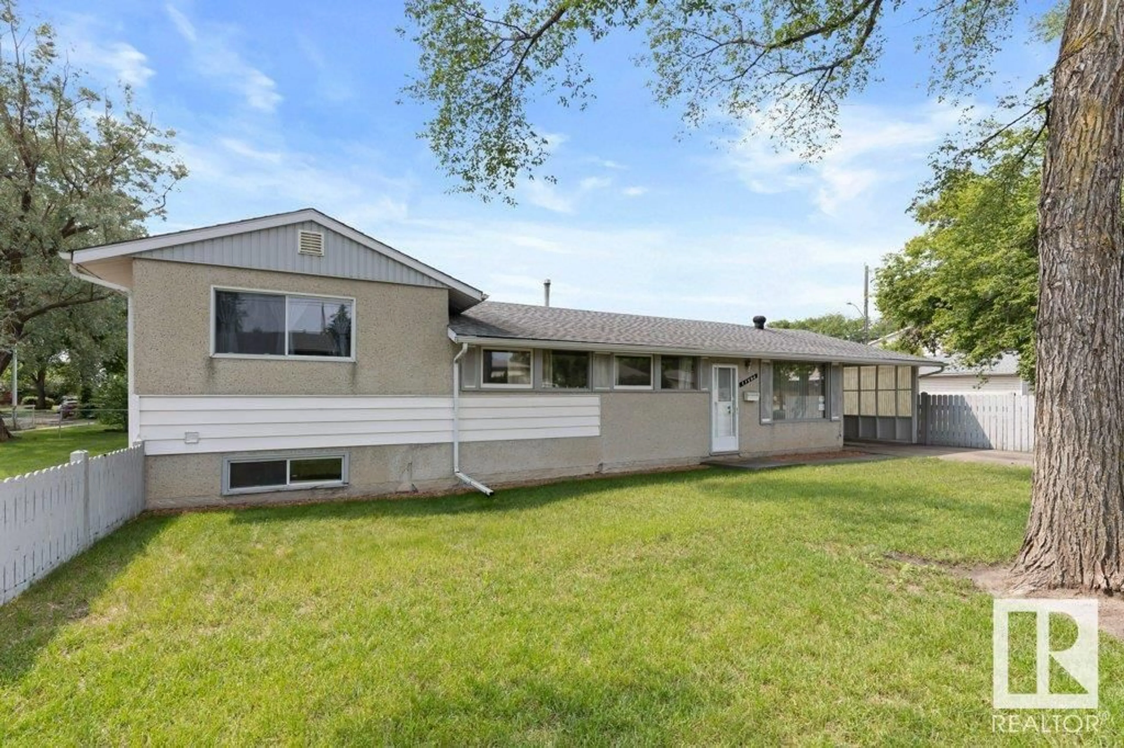 Home with vinyl exterior material, street for 11403 129 AV, Edmonton Alberta T5E0M2