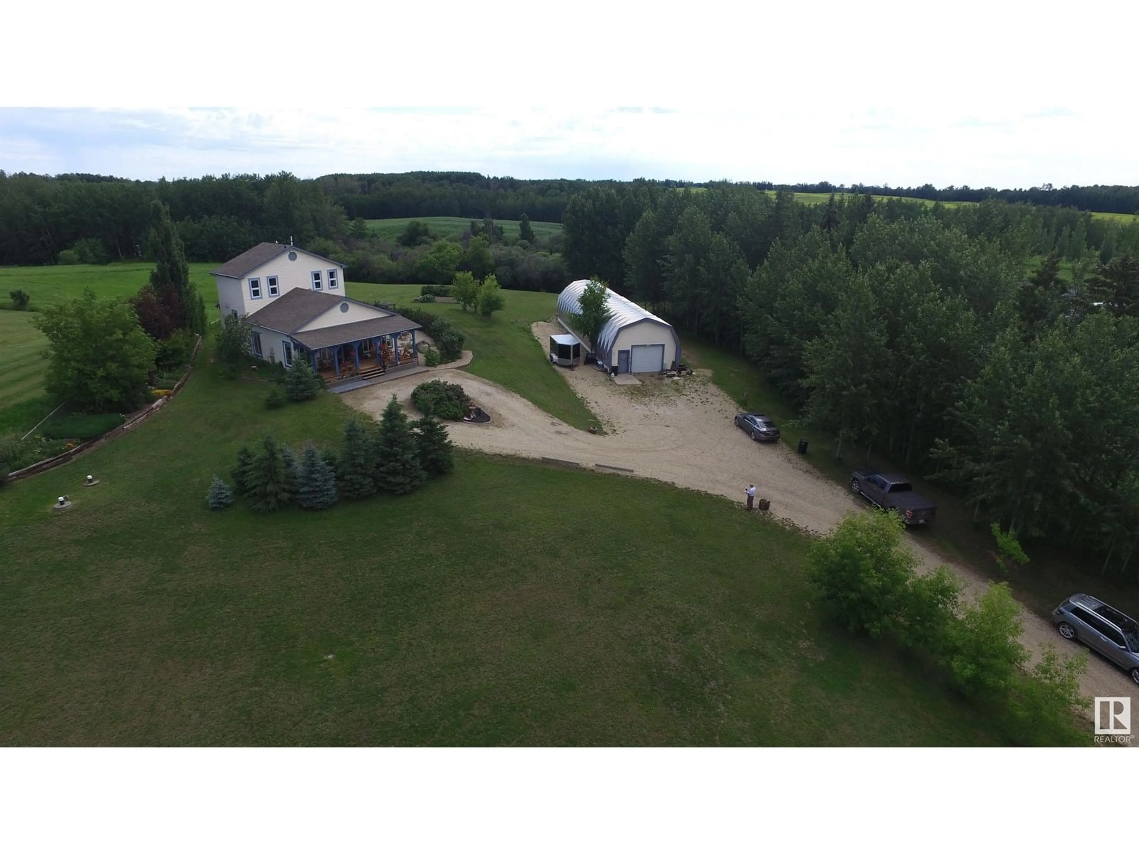 A pic from outside/outdoor area/front of a property/back of a property/a pic from drone, water/lake/river/ocean view for #22 - 51513 RANGE ROAD RD, Rural Parkland County Alberta T7Y2H9
