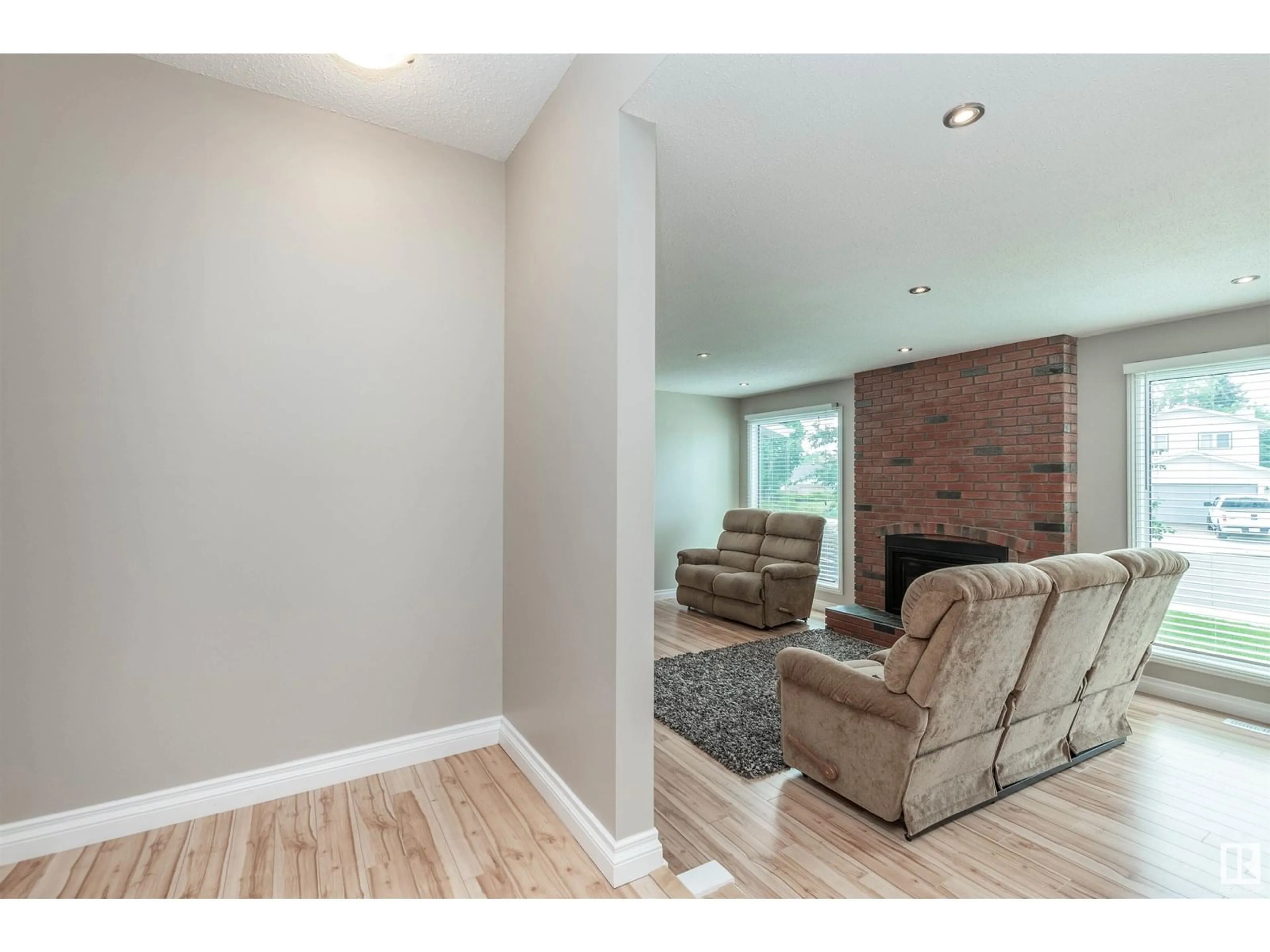 Living room with furniture, wood/laminate floor for 13840 30 ST, Edmonton Alberta T5Y1M5