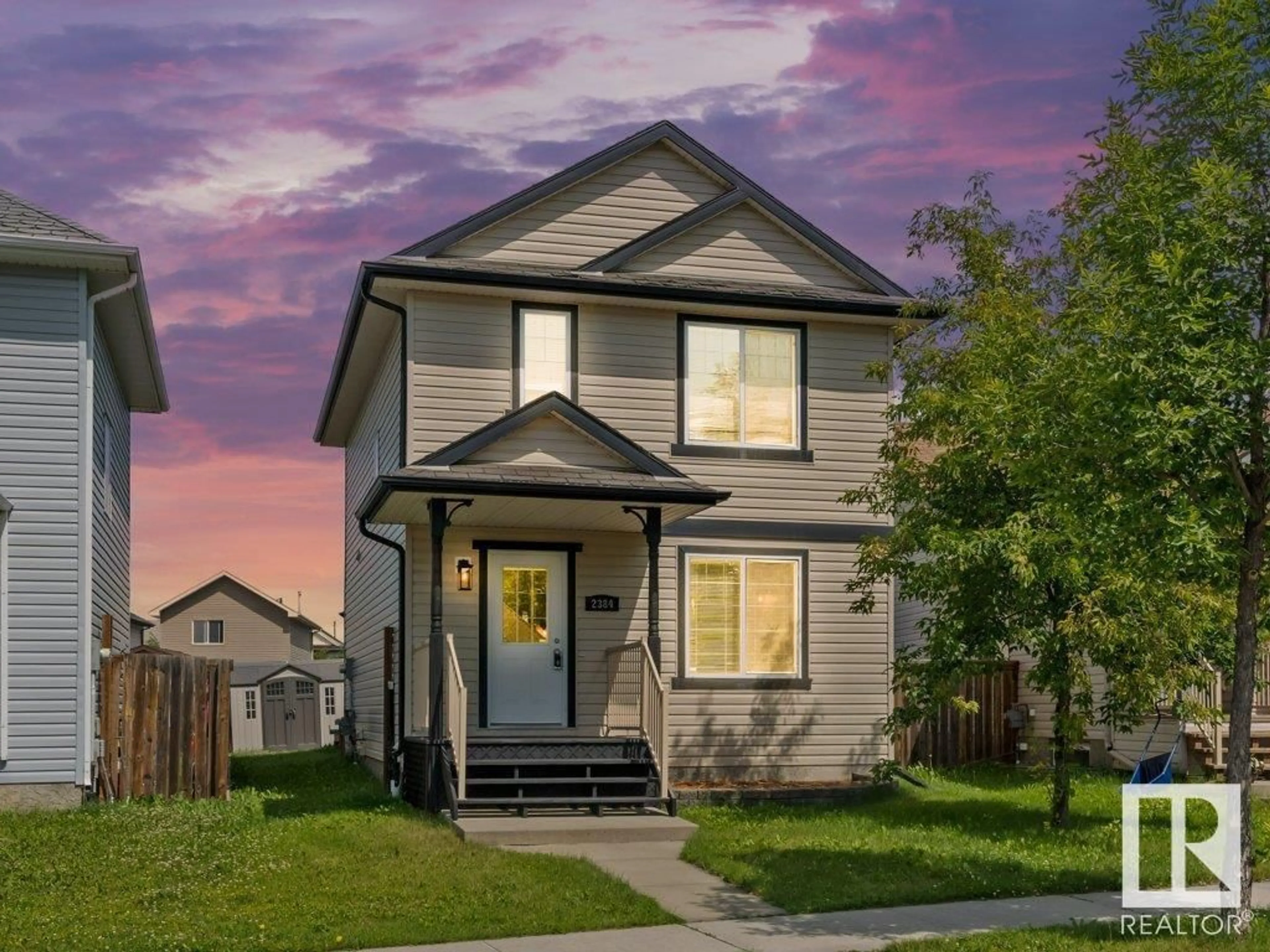 Home with vinyl exterior material, street for NW - 2384 28B AV, Edmonton Alberta T6T2A4