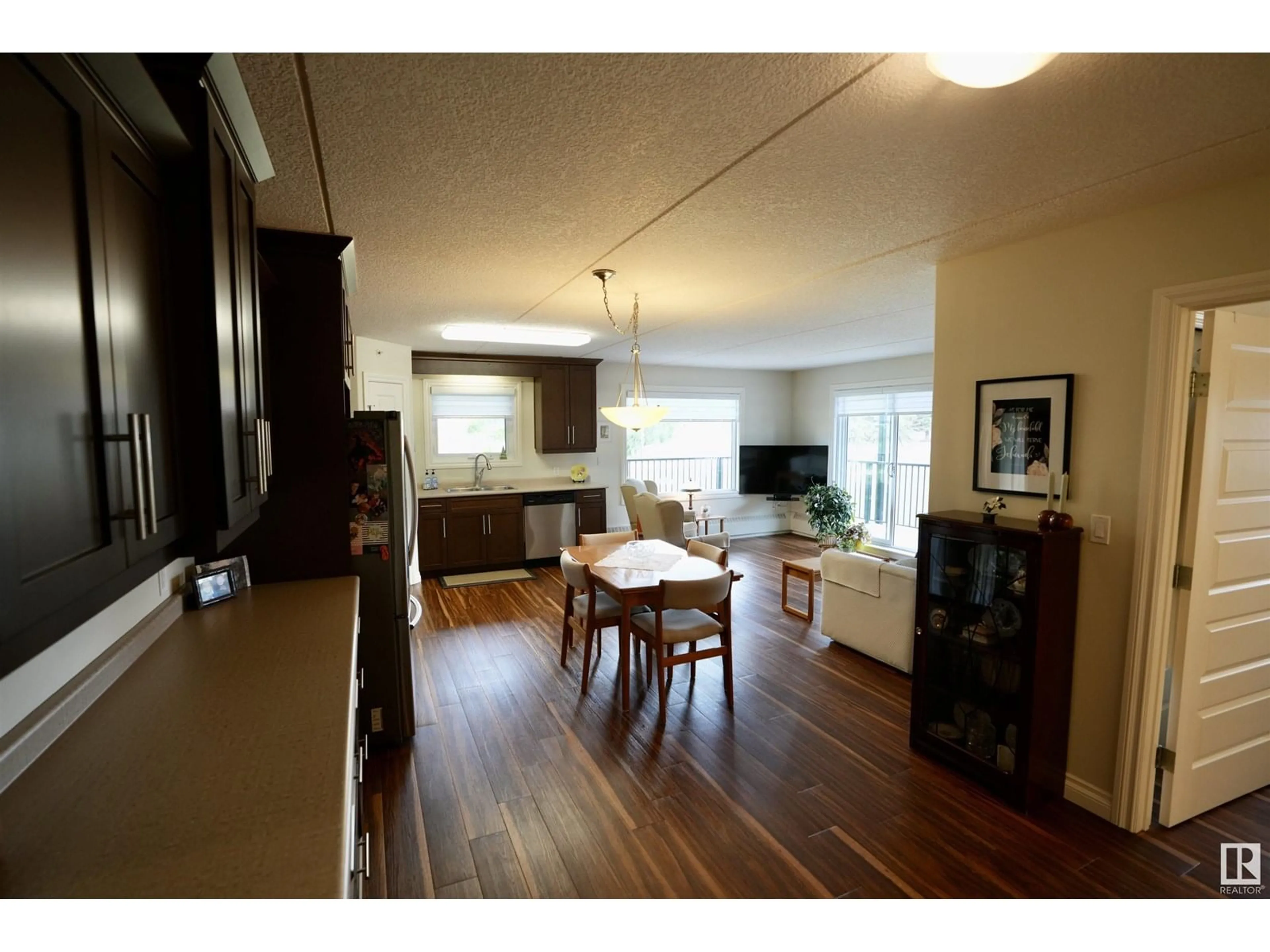 Living room with furniture, wood/laminate floor for 204 - 4614A LAKESHORE DRIVE, St. Paul Town Alberta T0A3A3